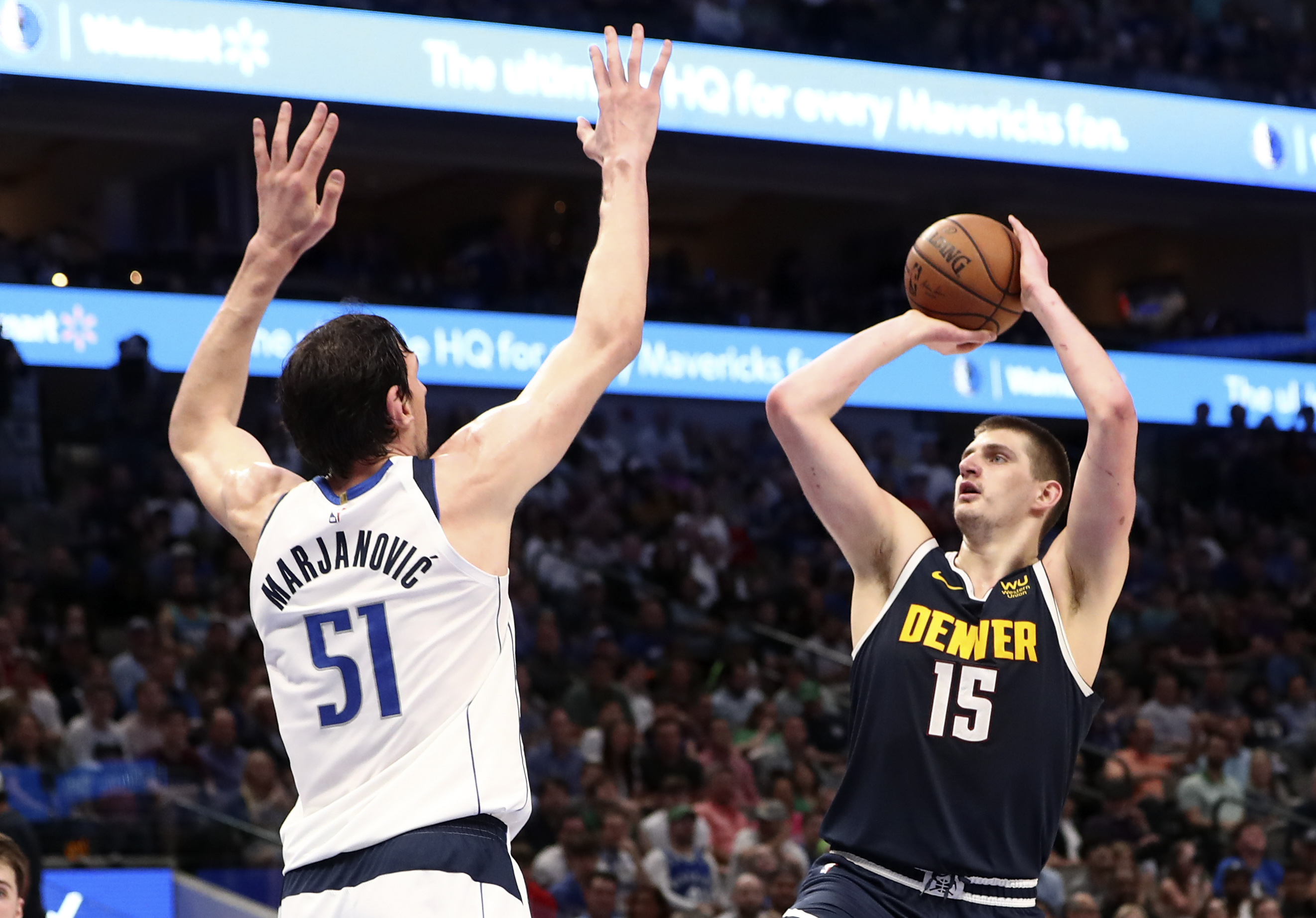 Mar 11, 2020; Dallas, Texas, USA;  Denver Nuggets center Nikola Jokic (15) shoots over Dallas Mavericks center Boban Marjanovic (51) during the second half at American Airlines Center. Mandatory Credit: Kevin Jairaj-USA TODAY Sports - 14173331