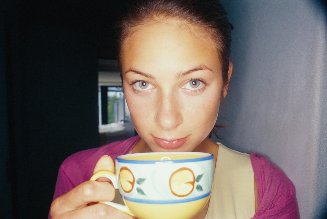 Close up of woman having cup of coffee