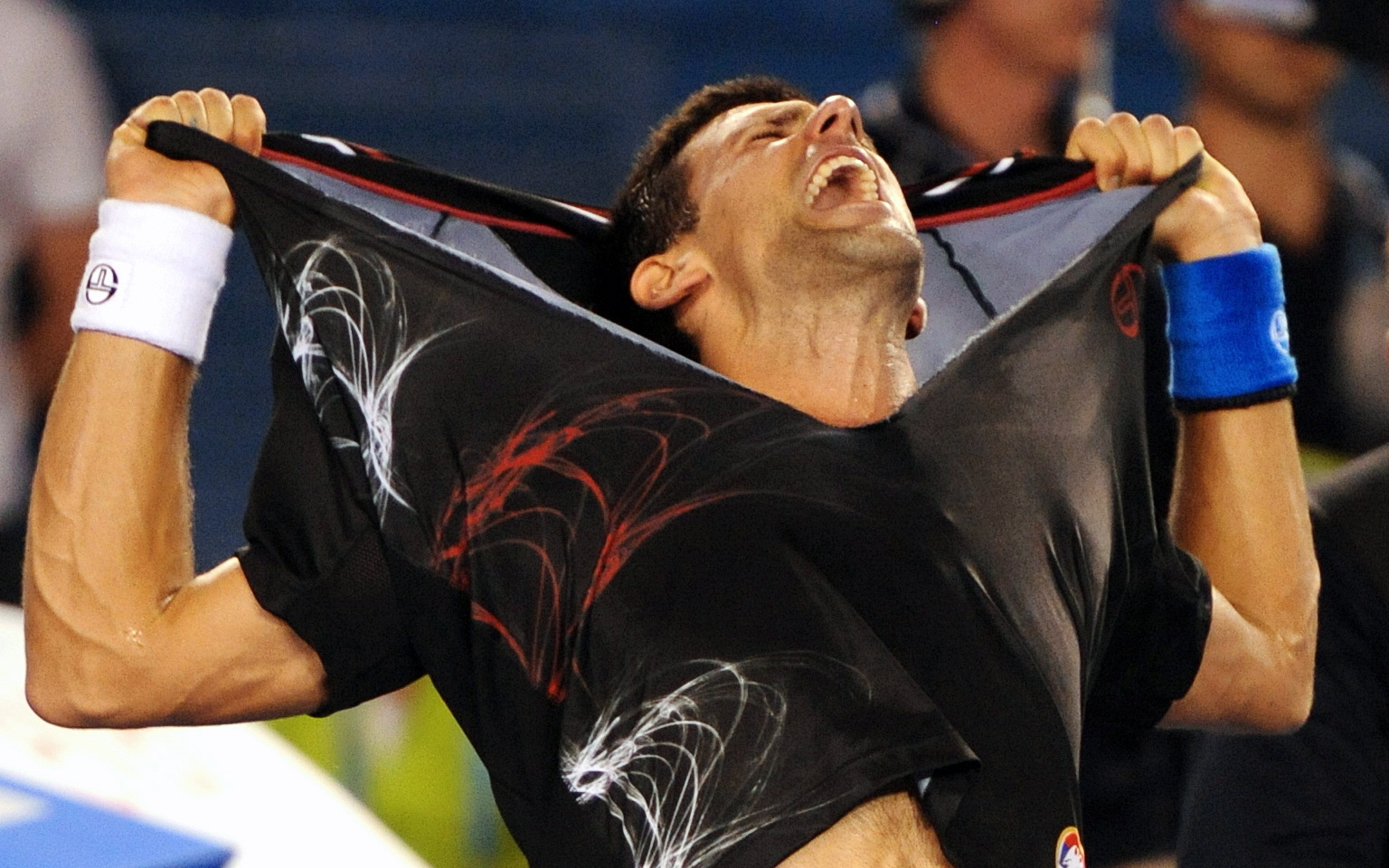 epa03084874 Novak Djokovic of Serbia celebrates after defeating Rafael Nadal of Spain in the men's final of the Australian Open Grand Slam tennis tournament in Melbourne, Monday, January, 30, 2012. Djokovic won in five sets.  EPA/JOE CASTRO