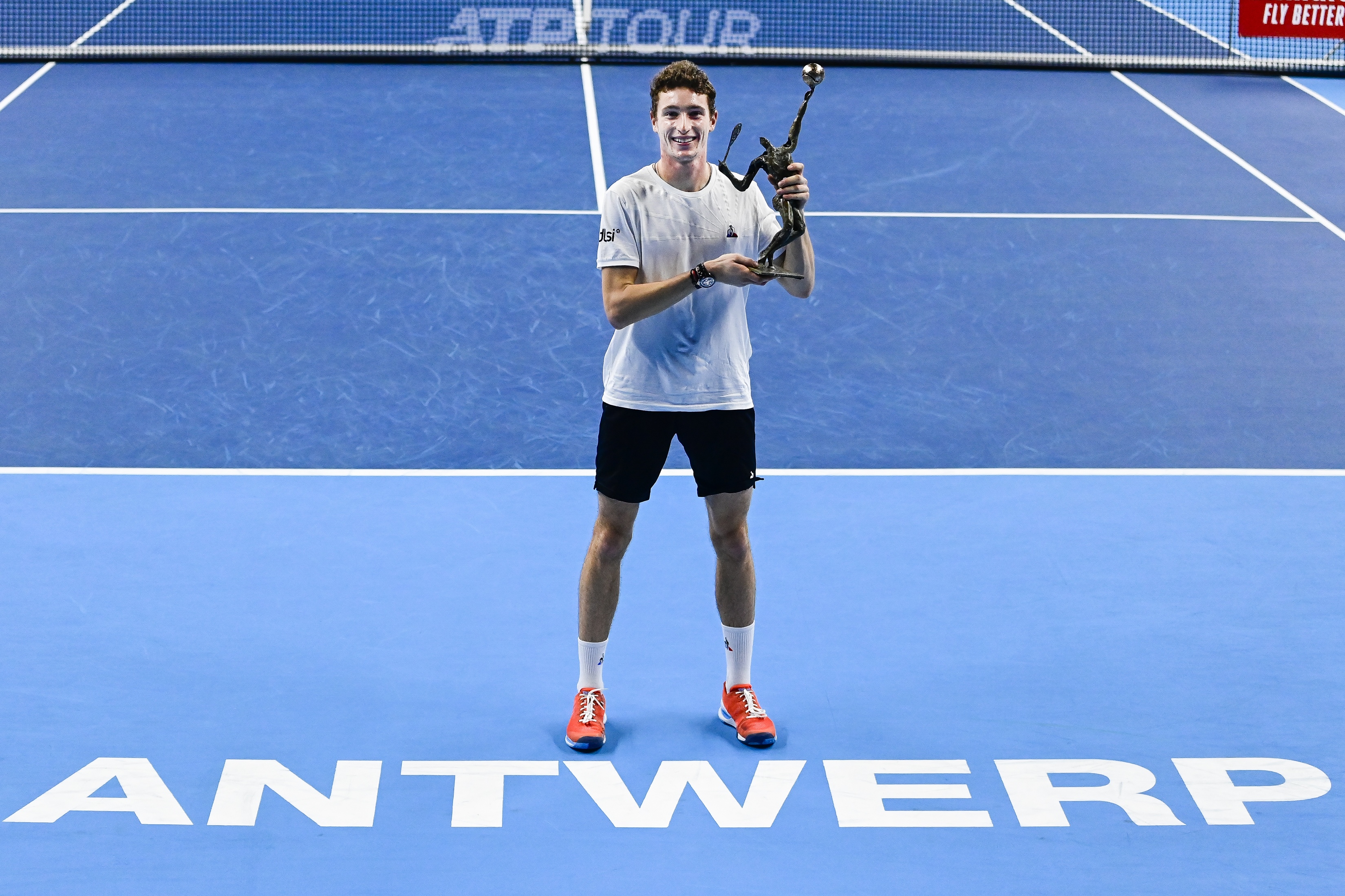 epa08773422 French Ugo Humbert celebrates with the trophy after winning the final match against Australian Alex De Minaur at the ATP Tennis European Open tournament in Antwerp, Belgium, 25 October 2020.  EPA-EFE/Laurie Dieffembacq / POOL