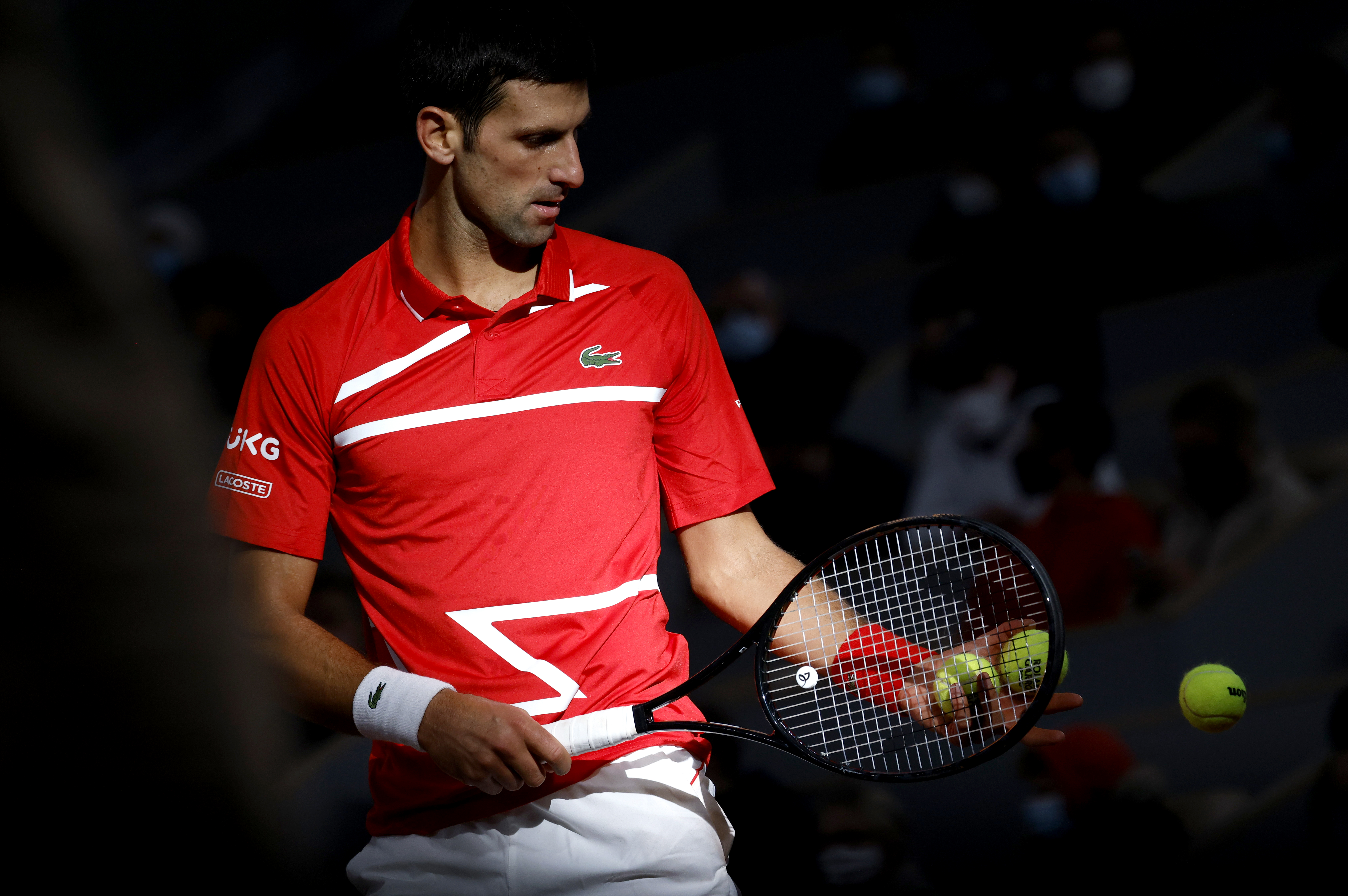 epa08735910 Novak Djokovic of Serbia prepares to serve to Rafael Nadal of Spain during their men?s final match during the French Open tennis tournament at Roland ?Garros in Paris, France, 11 October 2020.  EPA-EFE/YOAN VALAT