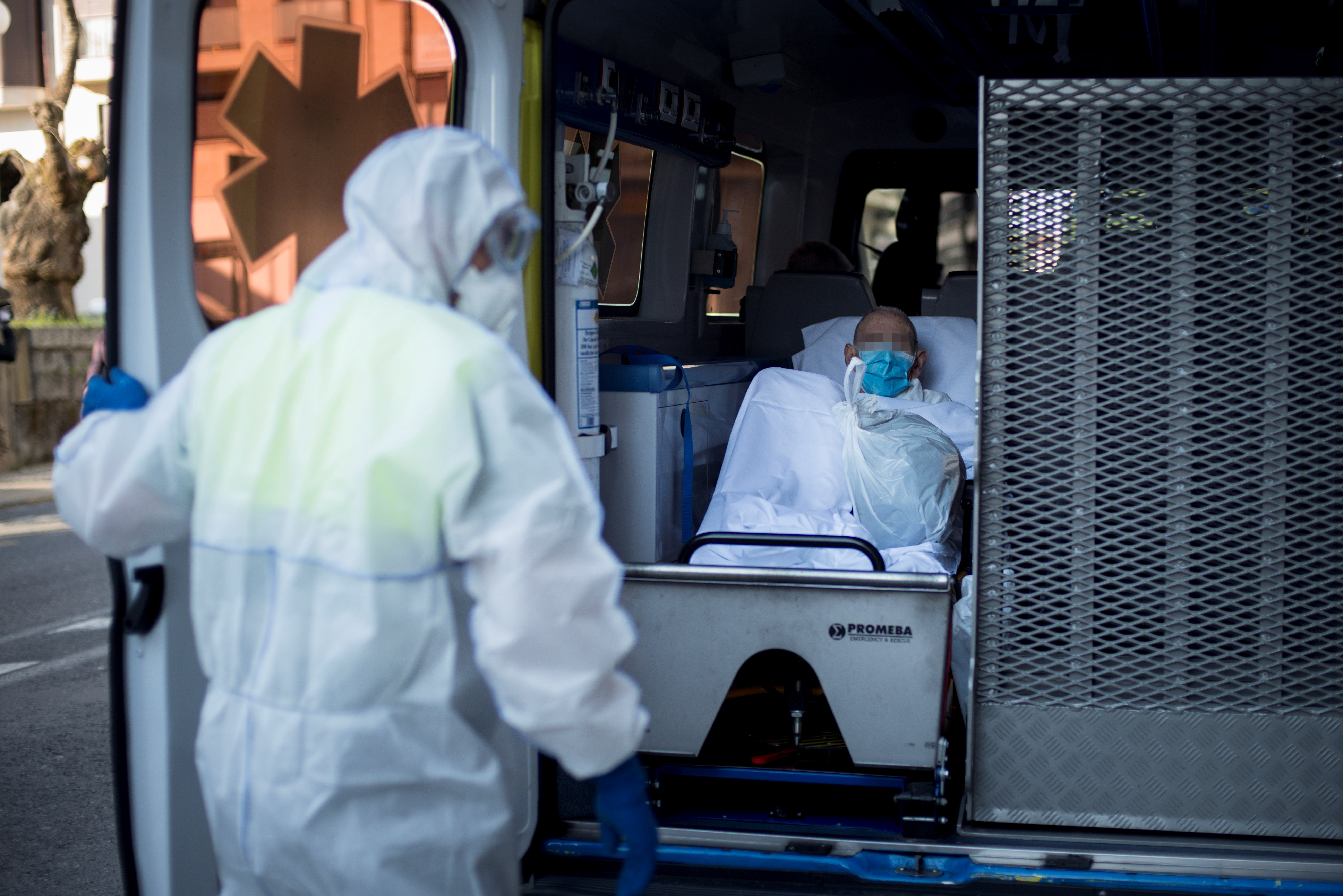 epa08319504 An old man from the San Carlos de Celanova nursing home is moved to another nursing home in Orense, northwest Spain, 24 March 2020. San Carlos de Celanova nursing home has warned about 25 coronavirus cases.  EPA-EFE/Brais Lorenzo
