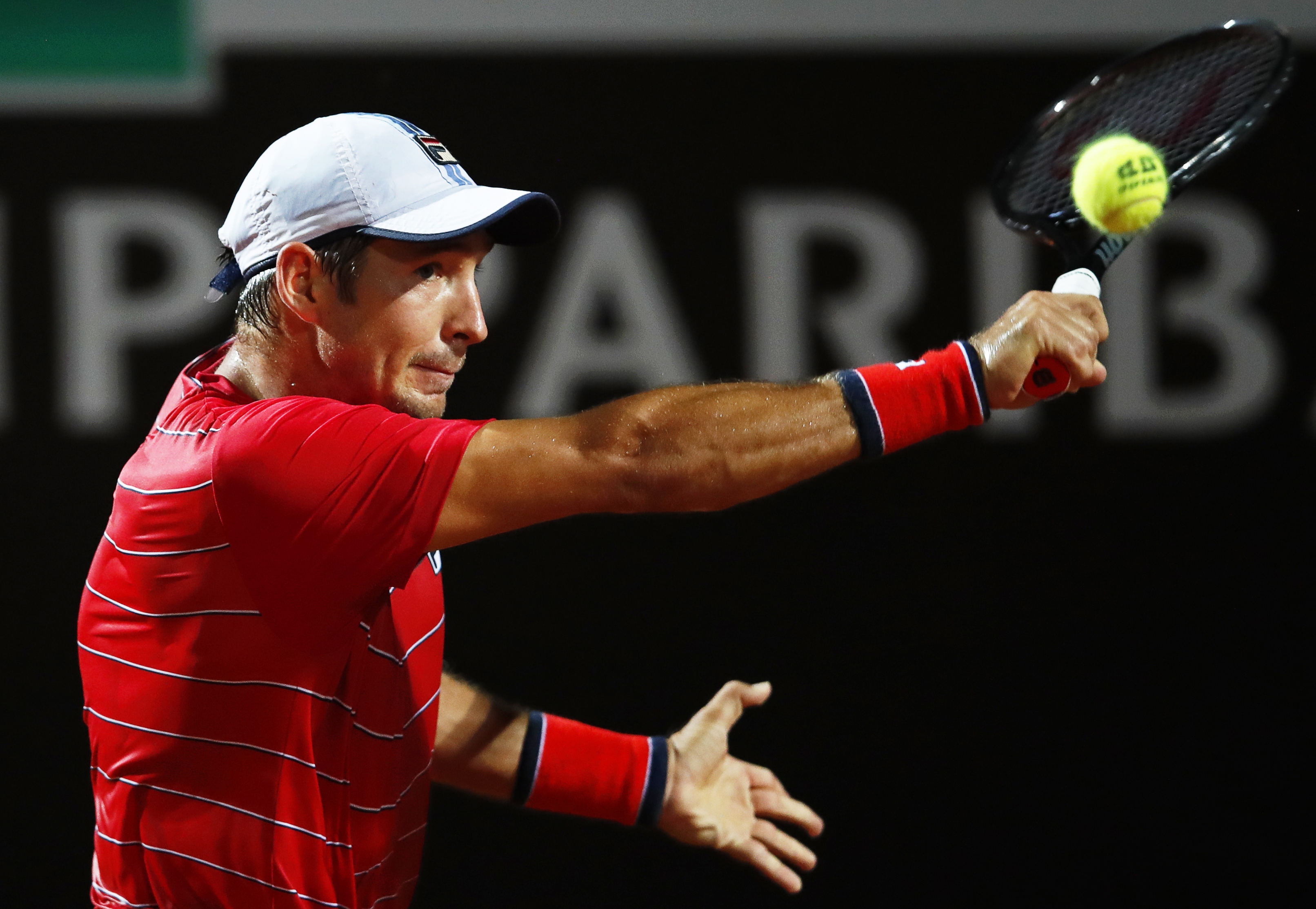 epa08679332 Dusan Lajovic of Serbia in action against Rafael Nadal of Spain during their men's singles third round match at the Italian Open tennis tournament in Rome, Italy, 18 September 2020.  EPA-EFE/Clive Brunskill / POOL