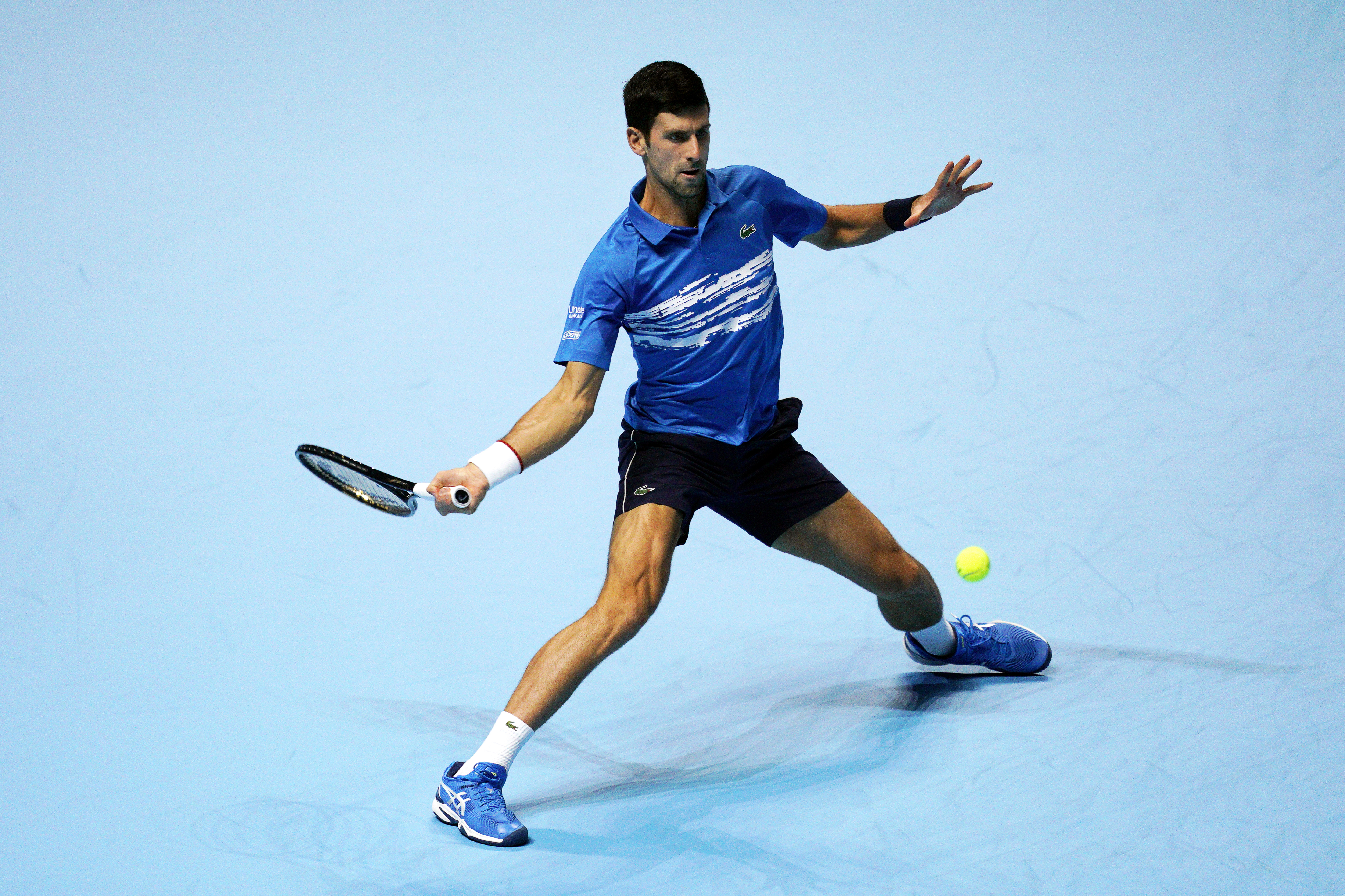 epa07986346 Novak Djokovic of Serbia in action against Matteo Berrettini of Italy during their round robin match at the ATP World Tour Finals tennis tournament in London, Britain, 10 November 2019.  EPA-EFE/WILL OLIVER