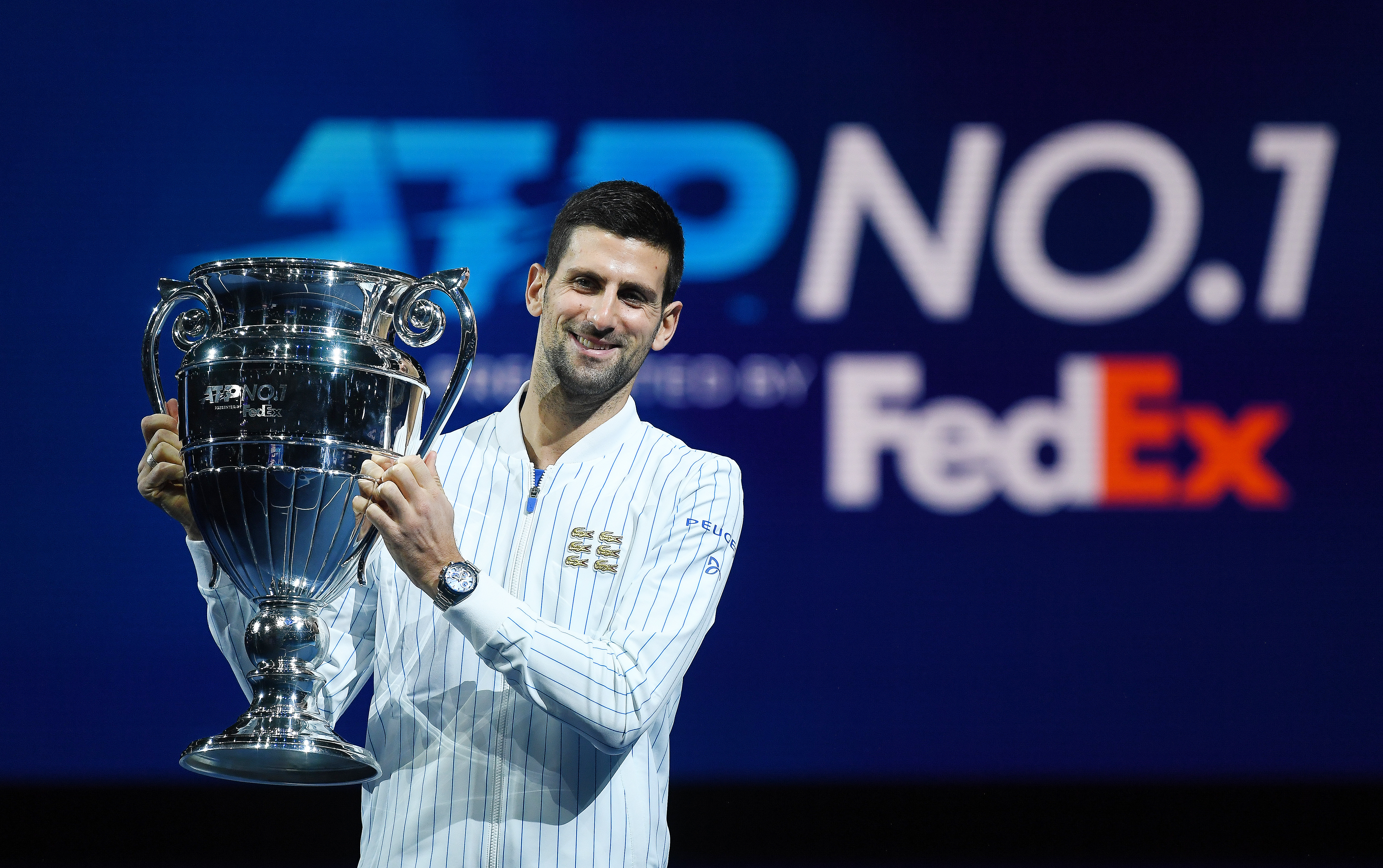 epa08822075 Serbia's Novak Djokovic holds up the ATP World No. 1 trophy at the Nitto ATP tennis finals in London, Britain, 15 November 2020.  EPA-EFE/ANDY RAIN