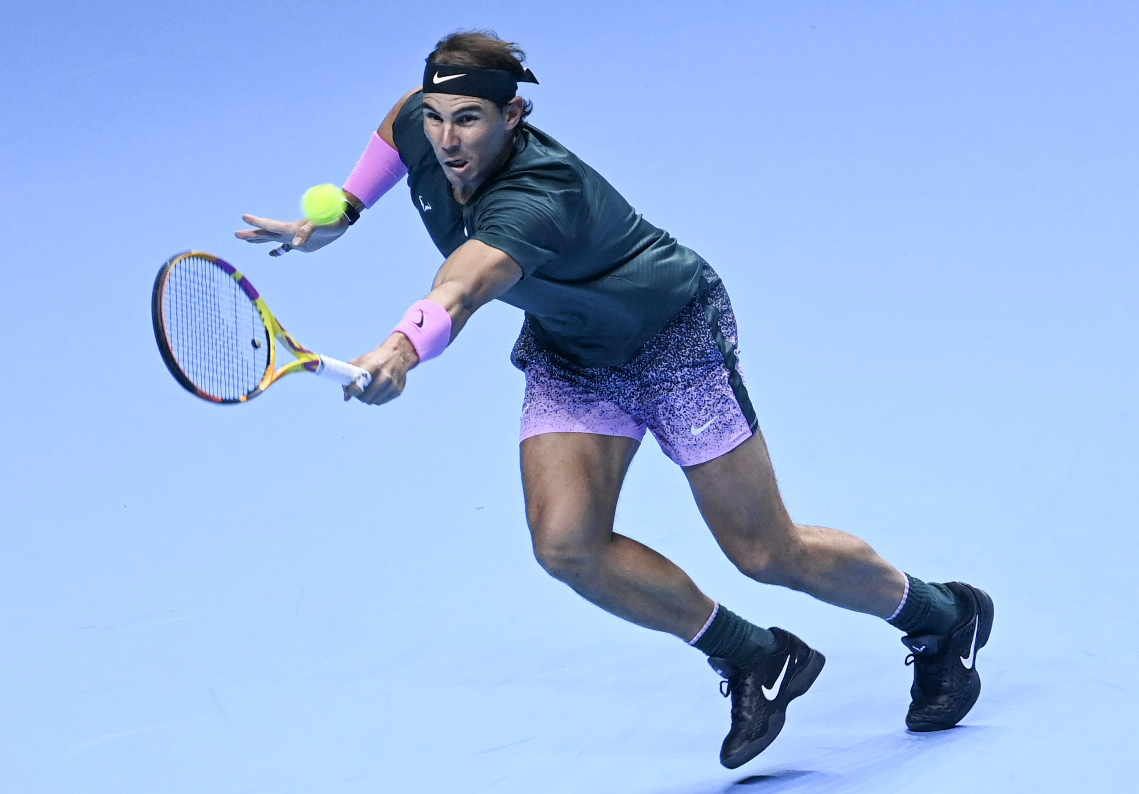 epa08822973 Rafael Nadal of Spain returns to Andrey Rublev of Russia during their group stage match at the ATP Finals in London, Britain, 15 November 2020.  EPA-EFE/ANDY RAIN
