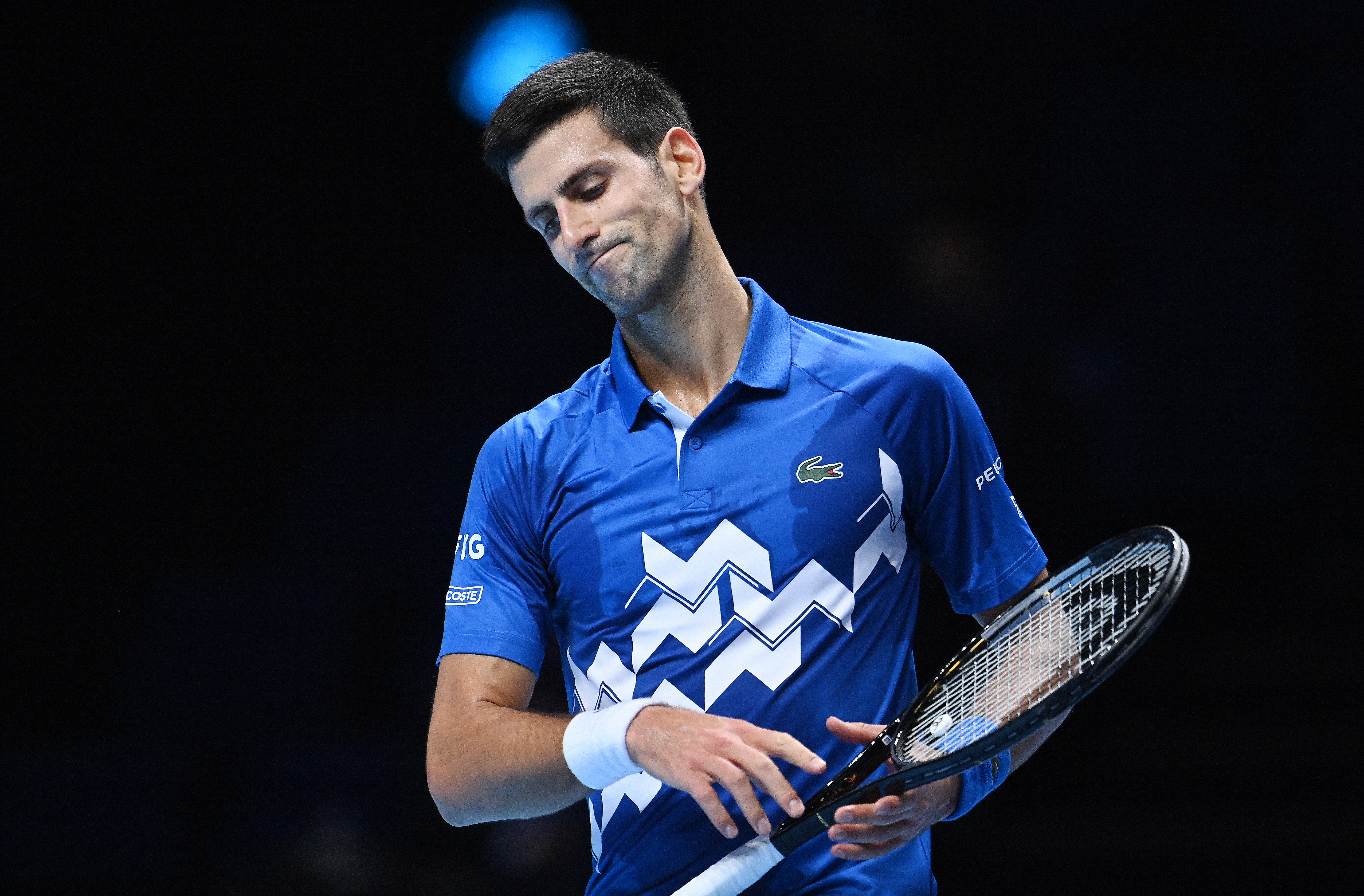 epa08828206 Serbia's Novak Djokovic reacts after losing a point against Russia's Daniil Medvedev during a Nitto ATP finals tennis match at the O2 Arena in  London, Britain, 18 November 2020.  EPA-EFE/ANDY RAIN