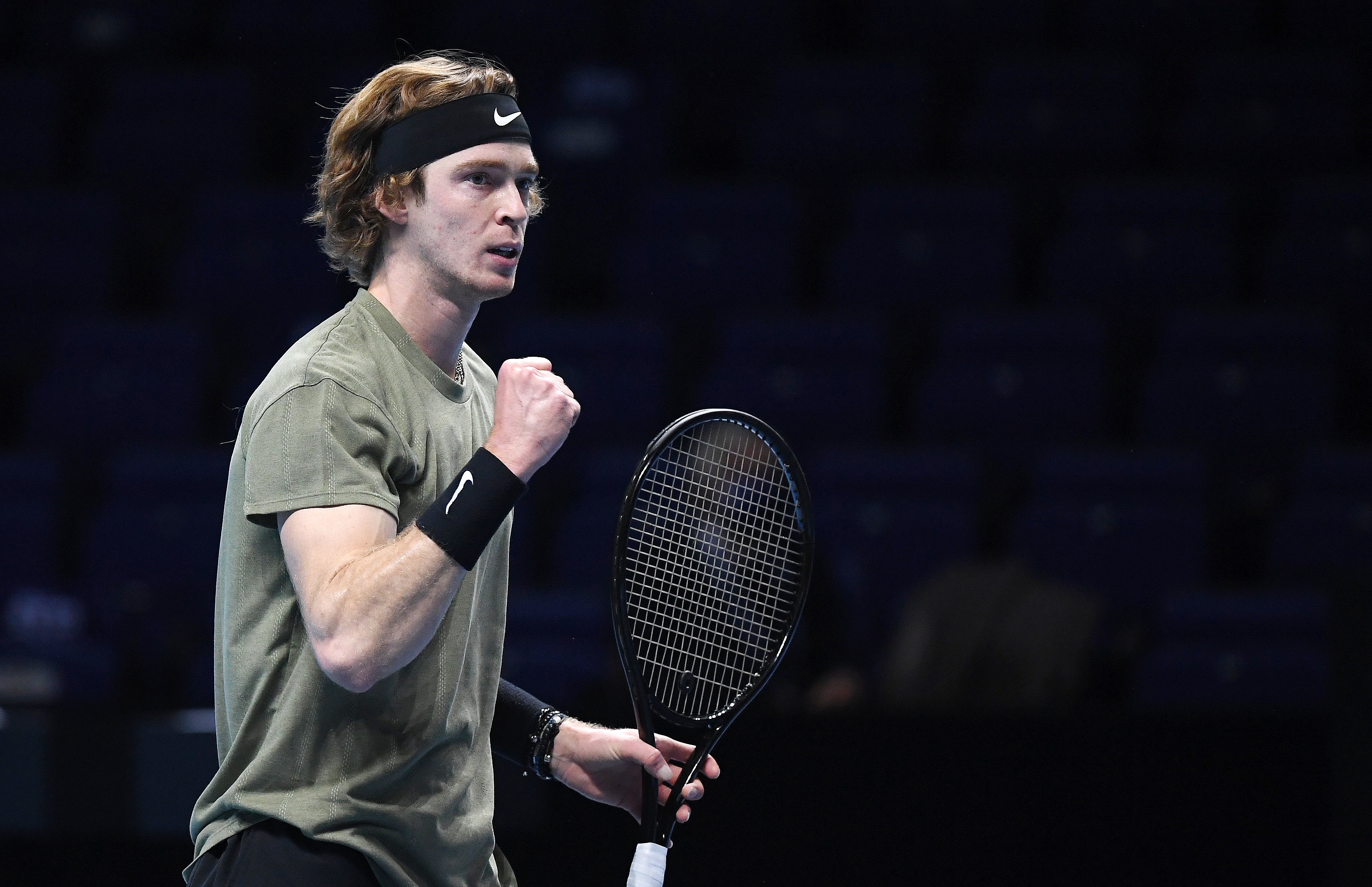 epa08829404 Andrey Rublev of Russia celebrates winning his group stage match against Dominic Thiem of Austria at the ATP Finals tennis tournament in London, Britain, 19 November 2020.  EPA-EFE/ANDY RAIN