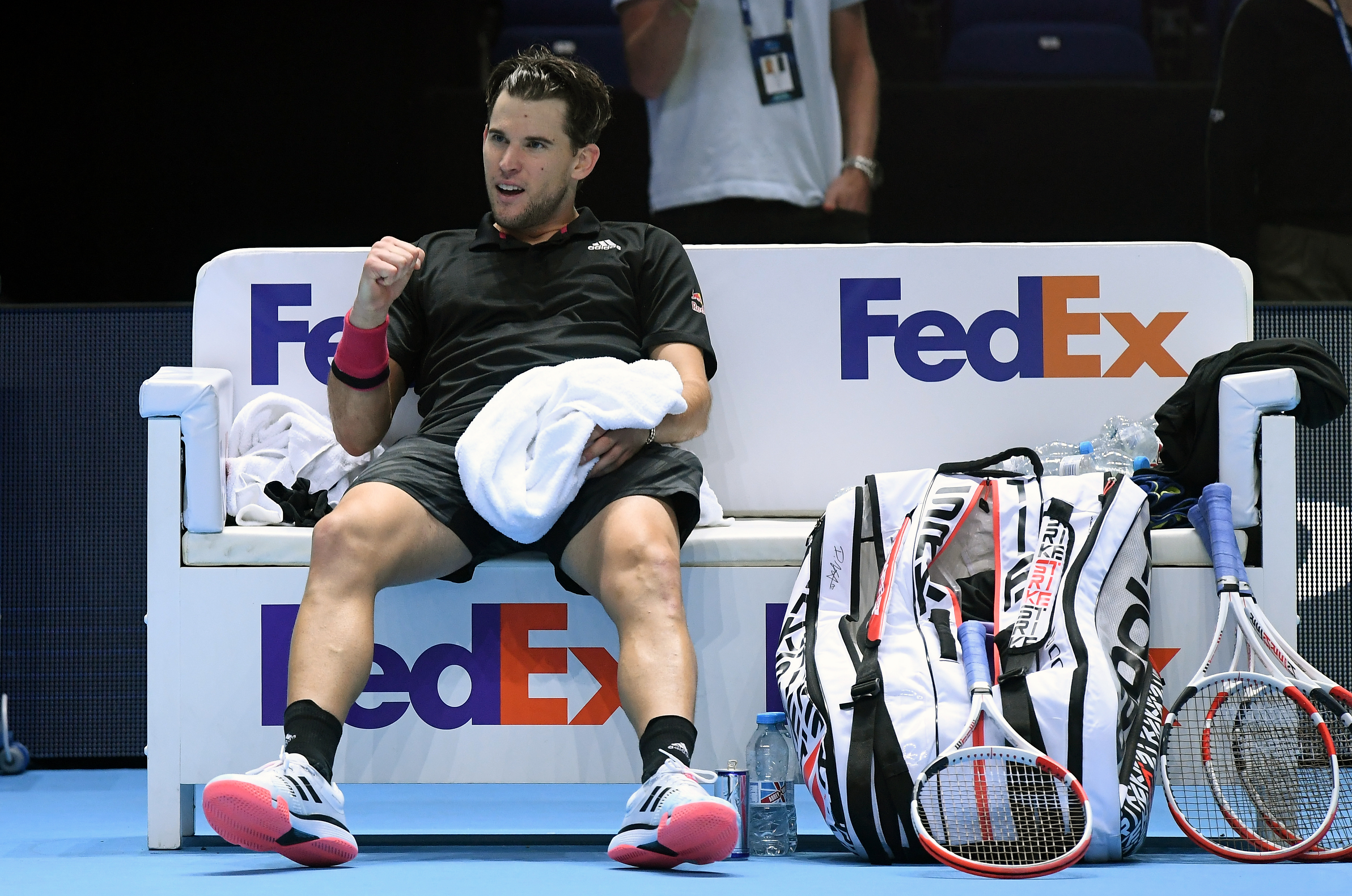 epa08834017 Dominic Thiem of Austria in action against Novak Djokovic of Serbia during their semi final match at the ATP World Tour Finals tennis tournament in London, Britain, 21 November 2020.  EPA-EFE/ANDY RAIN