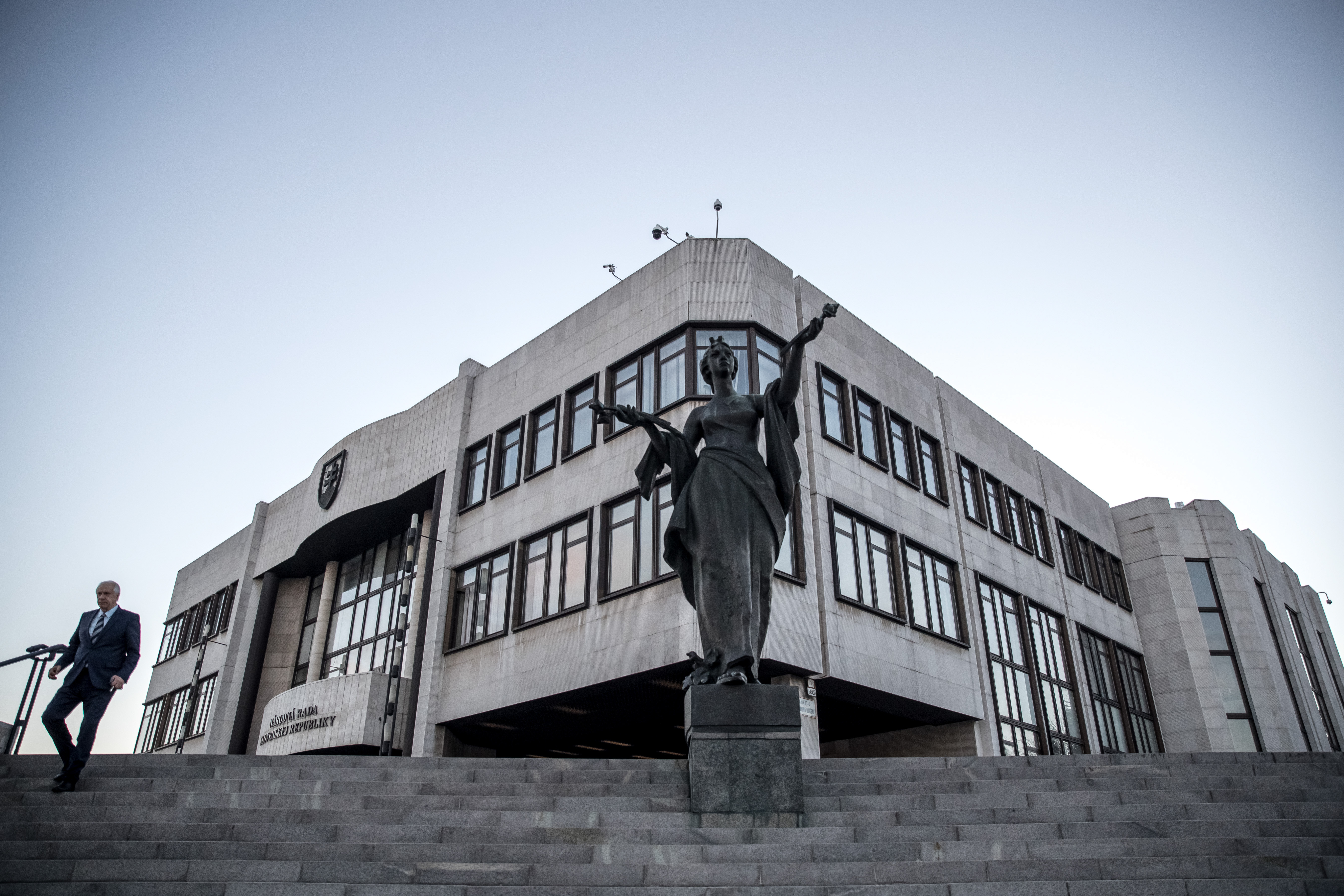 epa08231552 A man walks past the National Council of the Slovak Republic in Bratislava, Slovakia, 20 February 2020. Slovakia will be holding parliamentary elections on 29 February 2020.  EPA-EFE/MARTIN DIVISEK