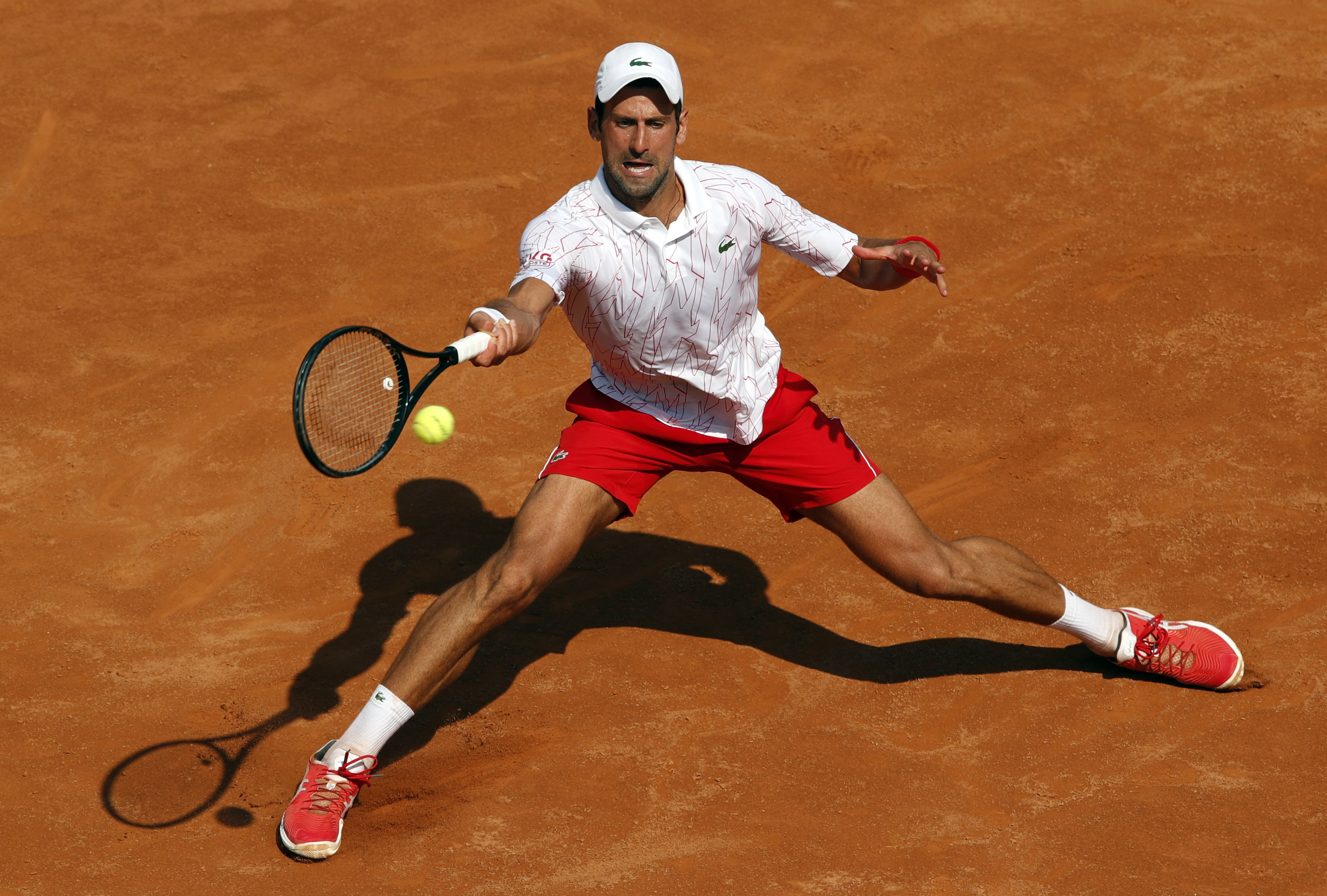 epa08672695 Novak Djokovic of Serbia in action during his second round match against Salvatore Caruso of Italy at the Italian Open in Rome, Italy, 16 September 2020.  EPA-EFE/Clive Brunskill / POOL