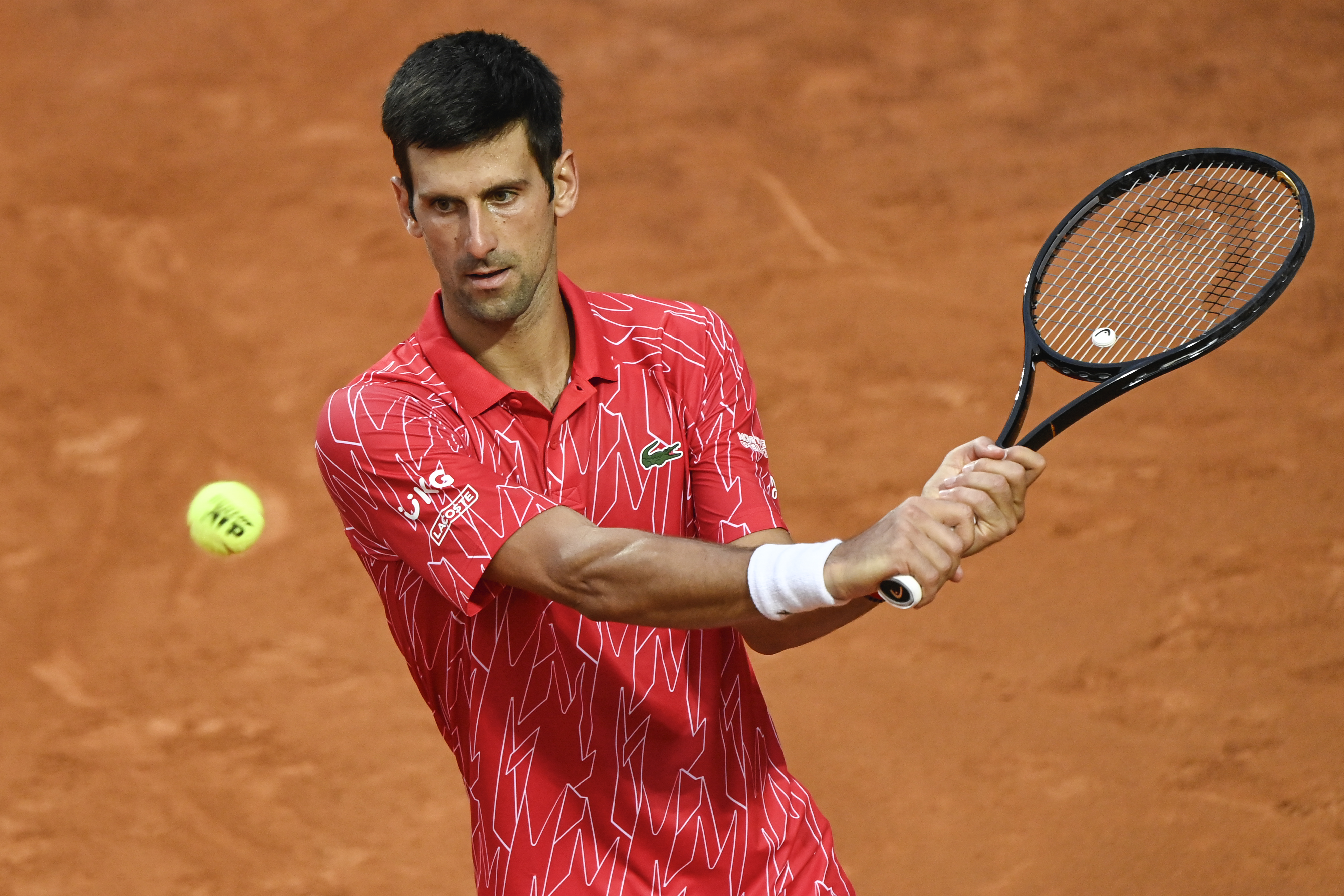 epa08686835 Novak Djokovic of Serbia in action during his men's singles final round match against Diego Schwartzman of Argentina at the Italian Open tennis tournament in Rome, Italy, 21 September 2020.  EPA-EFE/Riccardo Antimiani / POOL