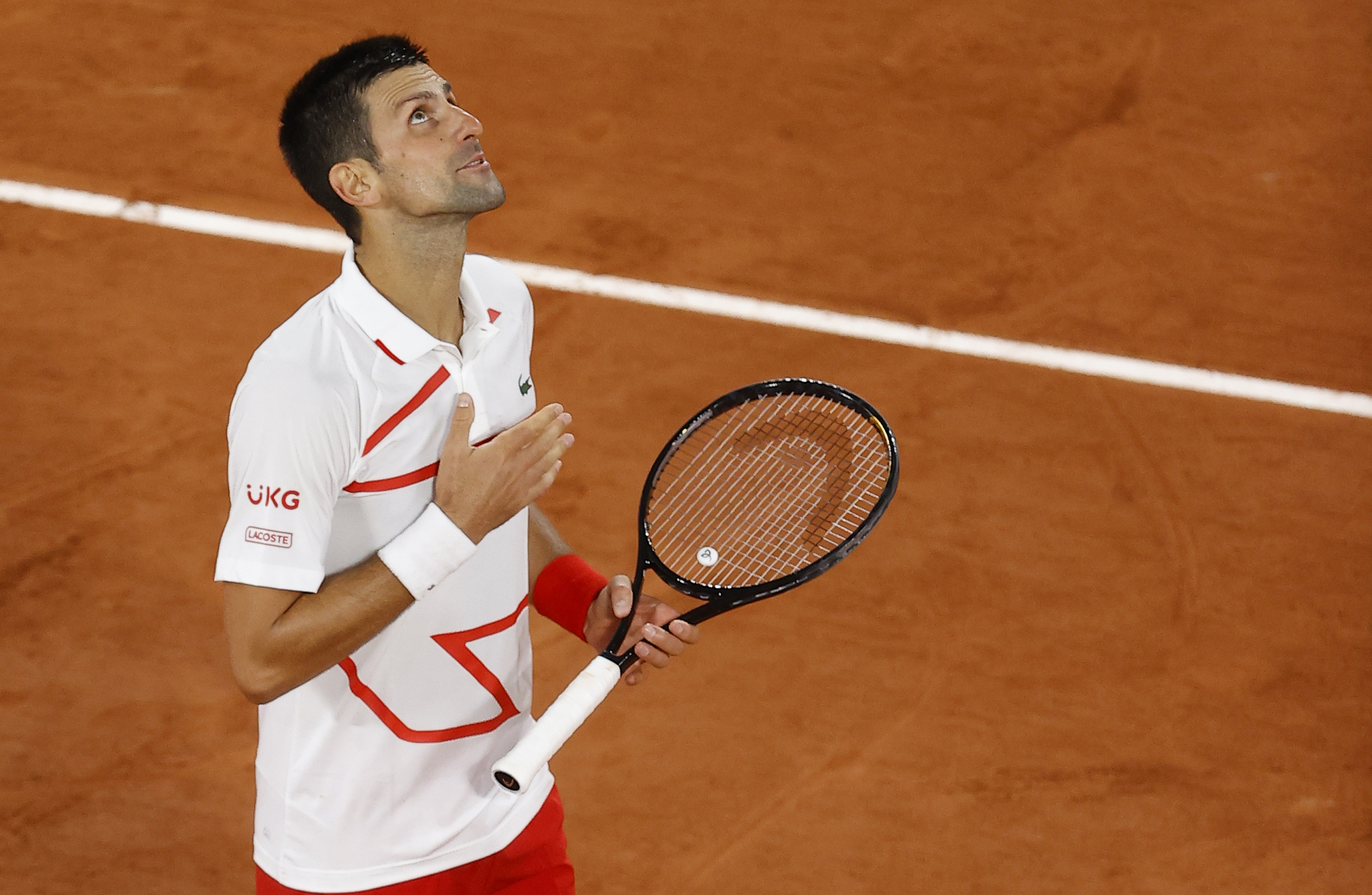 epa08706193 Novak Djokovic of Serbia celebrates after winning his first round match against Mikael Ymer of Sweden at the French Open tennis tournament at Roland Garros in Paris, France, 29 September 2020.  EPA-EFE/IAN LANGSDON
