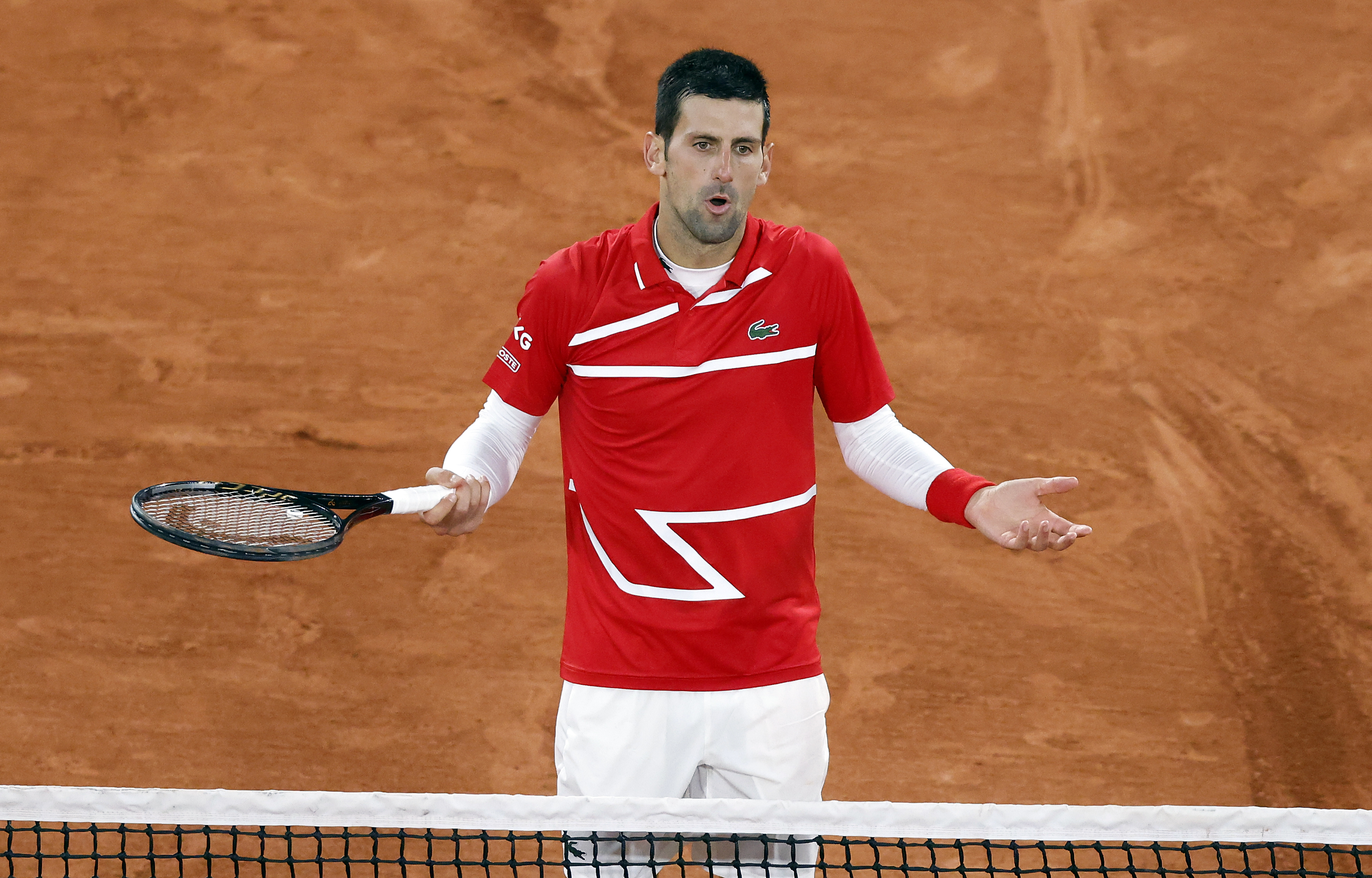 epa08722346 Novak Djokovic of Serbia reacts as he plays Karen Khachanov of Russia during their men?s fourth round match during the French Open tennis tournament at Roland ?Garros in Paris, France, 05 October 2020.  EPA-EFE/IAN LANGSDON