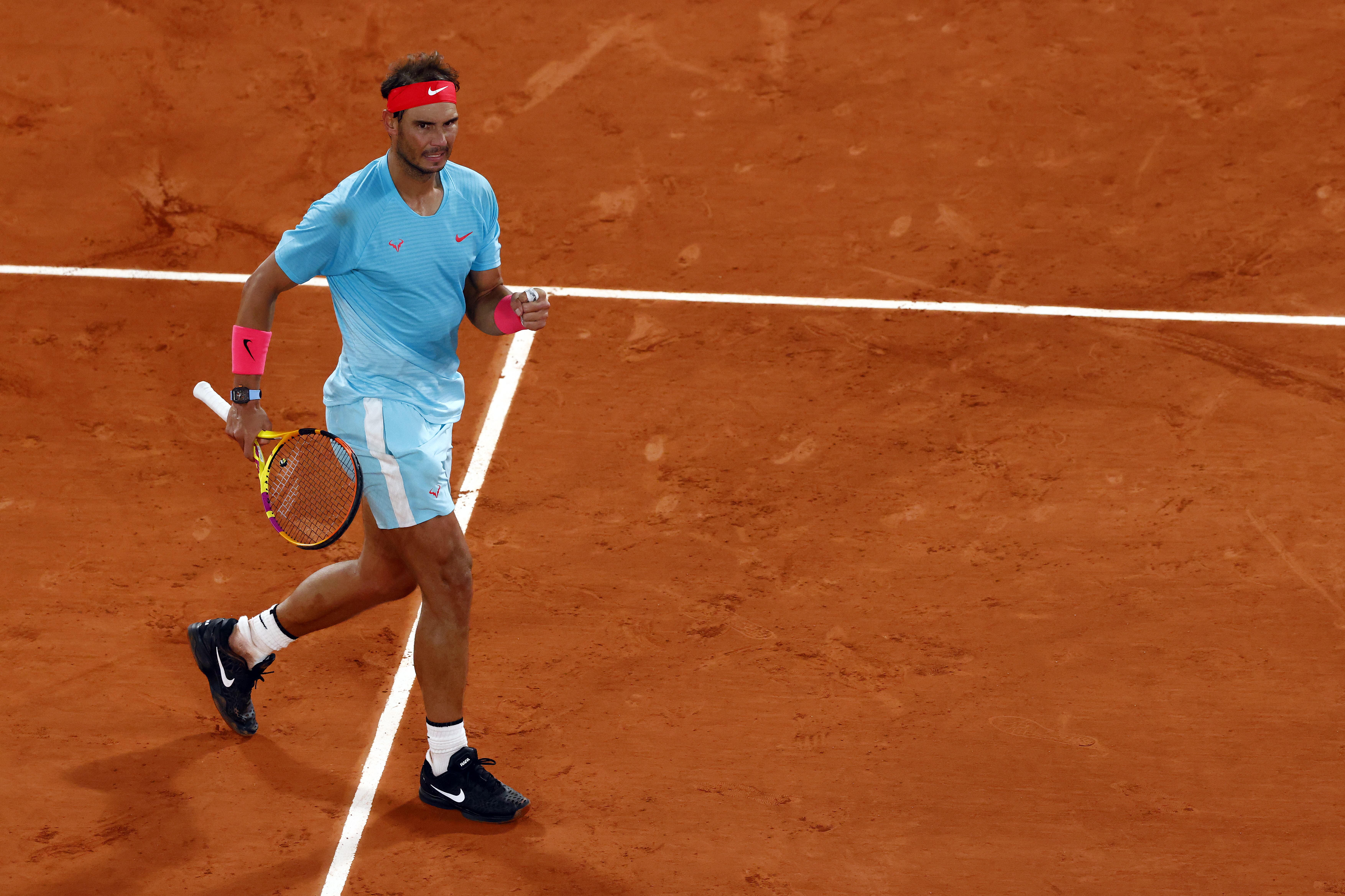 epa08725424 Rafael Nadal of Spain reacts as he plays Jannik Sinner of Italy during their men?s quarter final match during the French Open tennis tournament at Roland ?Garros in Paris, France, 06 October 2020.  EPA-EFE/IAN LANGSDON