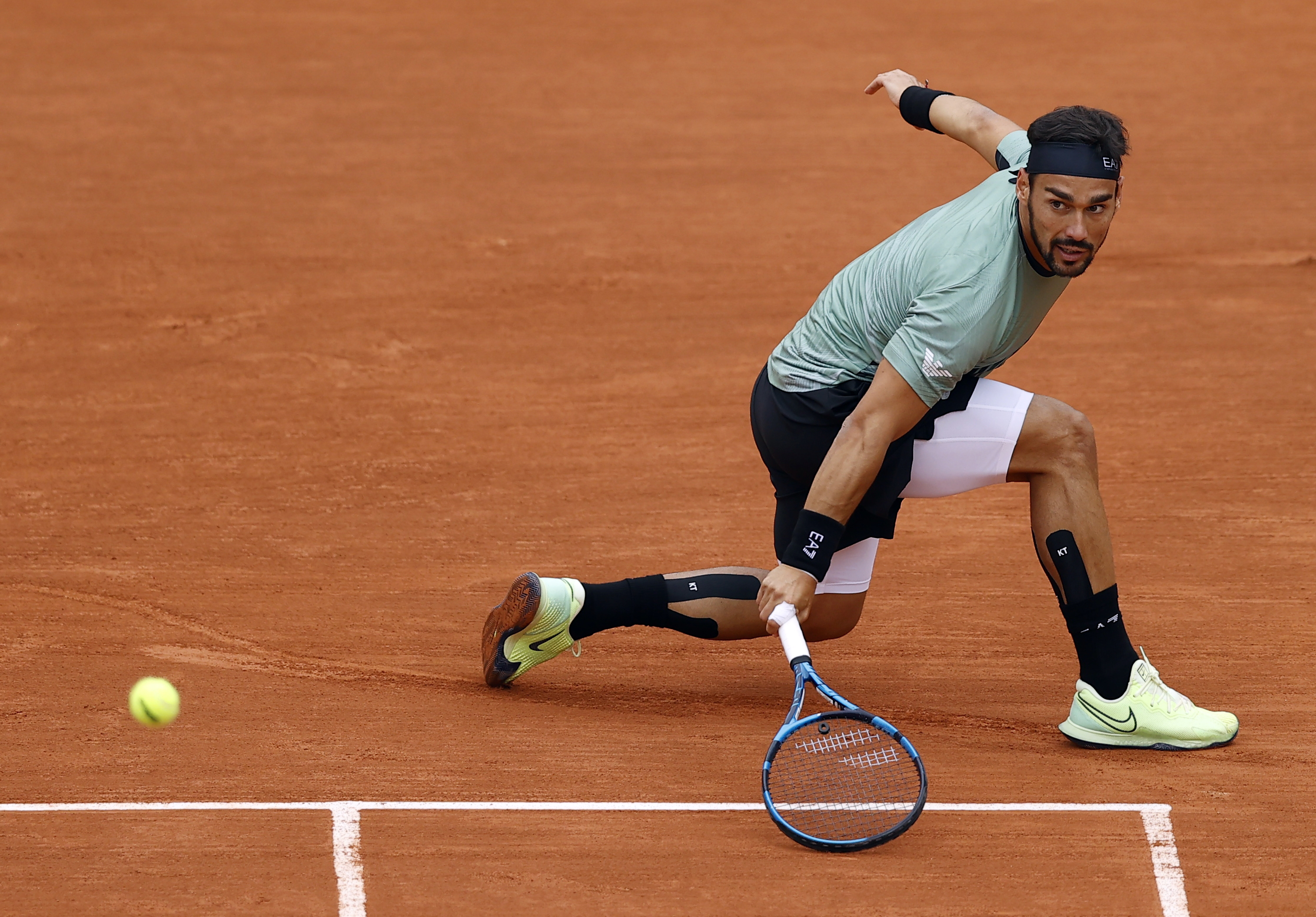 epa08703514 Fabio Fognini of Italy in action against Mikhail Kukushkin of Kazakhstan during their men?s first round match during the French Open tennis tournament at Roland ?Garros in Paris, France, 28 September 2020.  EPA-EFE/IAN LANGSDON