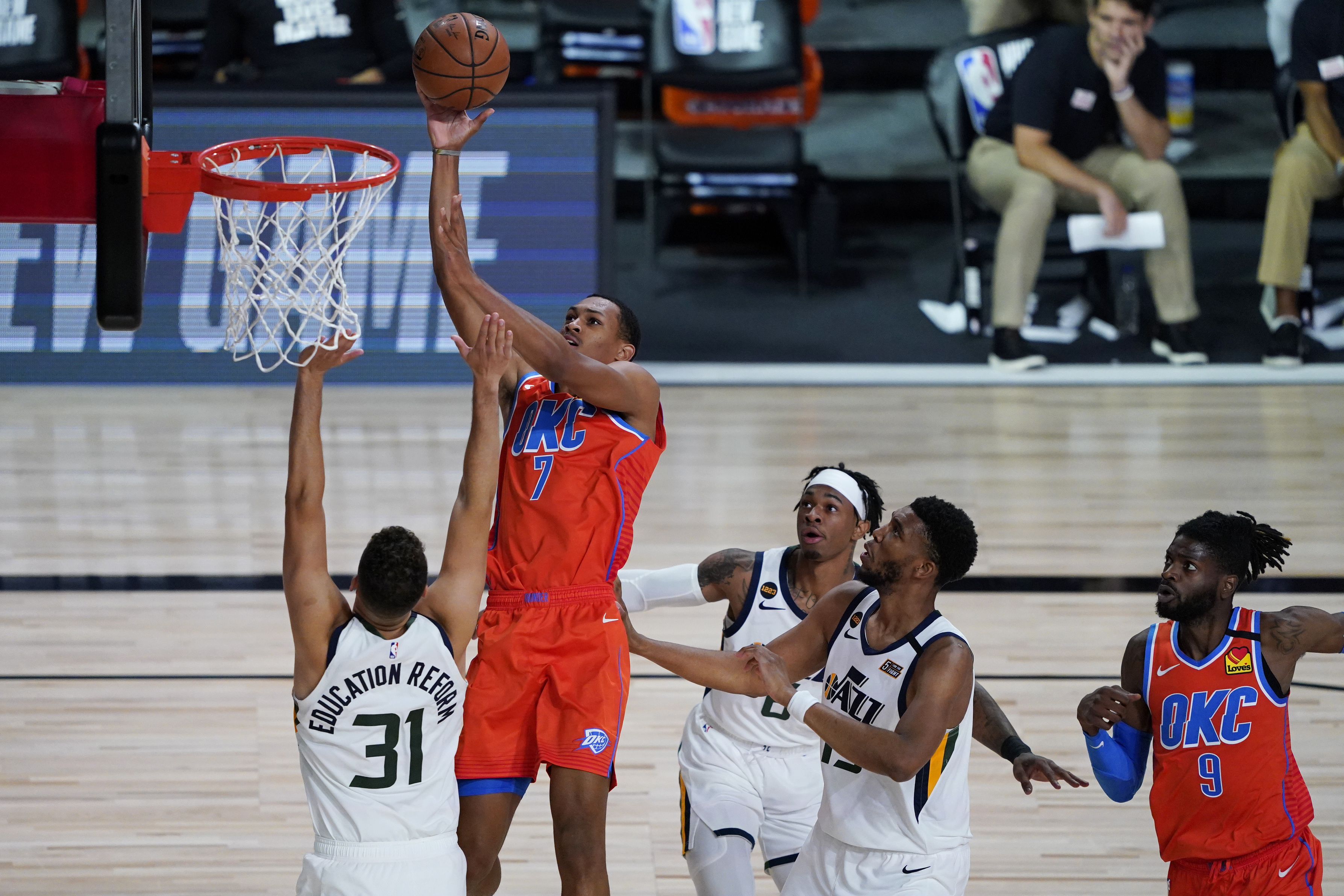 Oklahoma City Thunder's Darius Bazley (7) shoots over Utah Jazz's Georges Niang (31) during the second half of an NBA basketball game Saturday, Aug. 1, 2020, in Lake Buena Vista, Fla. (AP Photo/Ashley Landis, Pool)