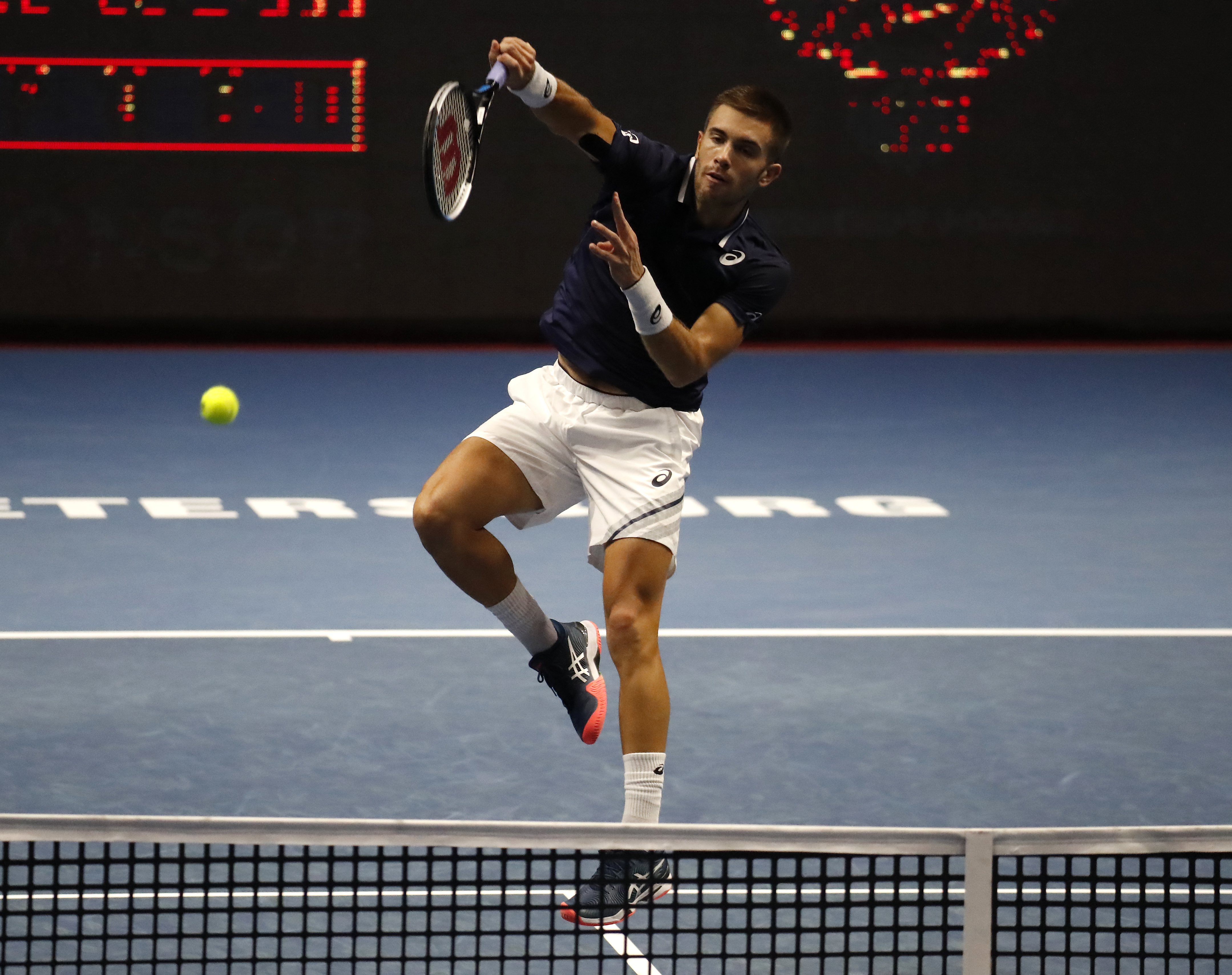 epa08750774 Borna Coric of Croatia in action against Reilly Opelka of the USA during their quarter final match of the St.Petersburg Open ATP tennis tournament in St.Petersburg, Russia, 16 October 2020.  EPA-EFE/ANATOLY MALTSEV
