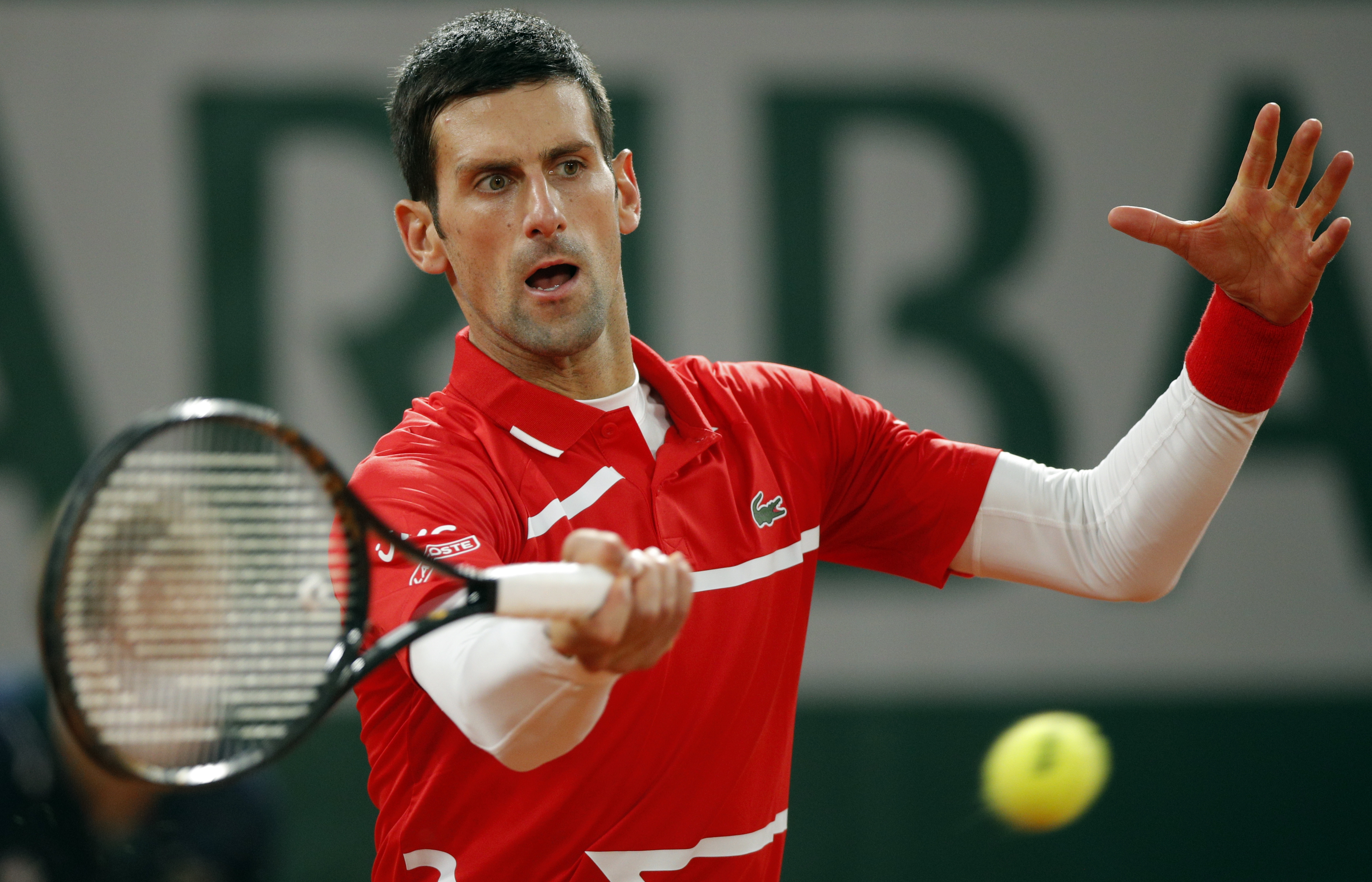 epa08735545 Novak Djokovic of Serbia in action against Rafael Nadal of Spain during their men?s final match during the French Open tennis tournament at Roland ?Garros in Paris, France, 11 October 2020.  EPA-EFE/YOAN VALAT