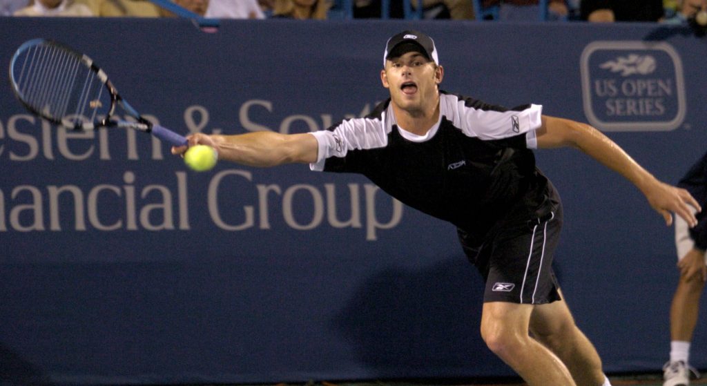 epa000246476 Andy Roddick of the United States returns a forehand against Andre Agassi of the United States  during their semifinal match of the Western &amp; Southern Financial Group Masters in Mason, Ohio on Saturday, 07 August 2004.  EPA/MIKE SIMONS