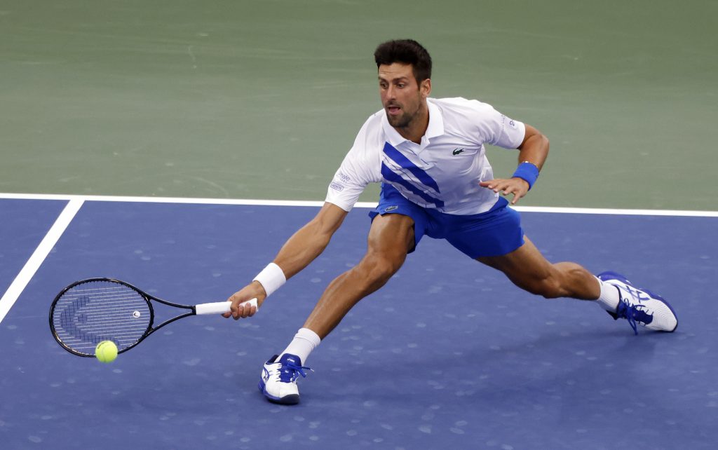 epa08634342 Novak Djokovic of Serbia in action against Milos Raonic of Canada during their Finals match at the Western and Southern Open at the USTA National Tennis Center in Flushing Meadows, New York, USA, 29 August 2020.  EPA-EFE/JASON SZENES