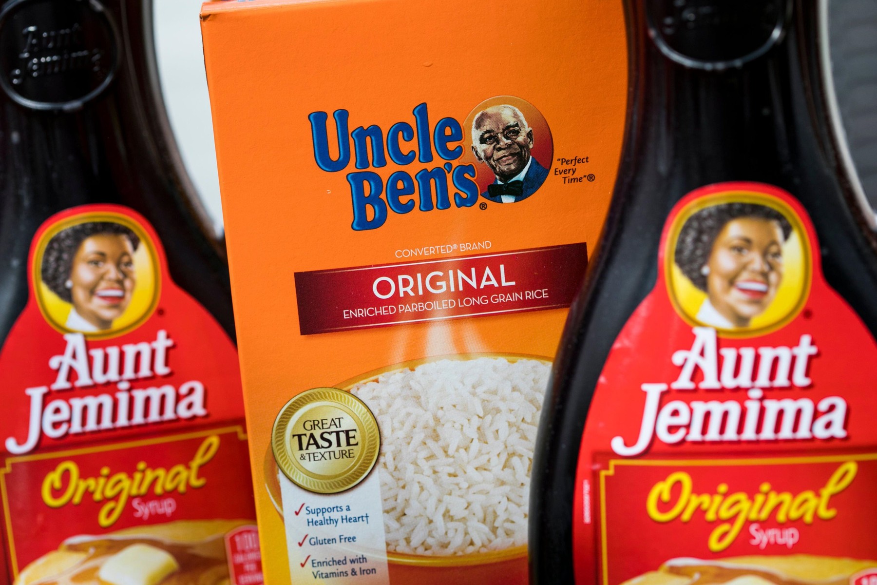 Bottles of Aunt Jemima syrup and Uncle Ben's rice products.