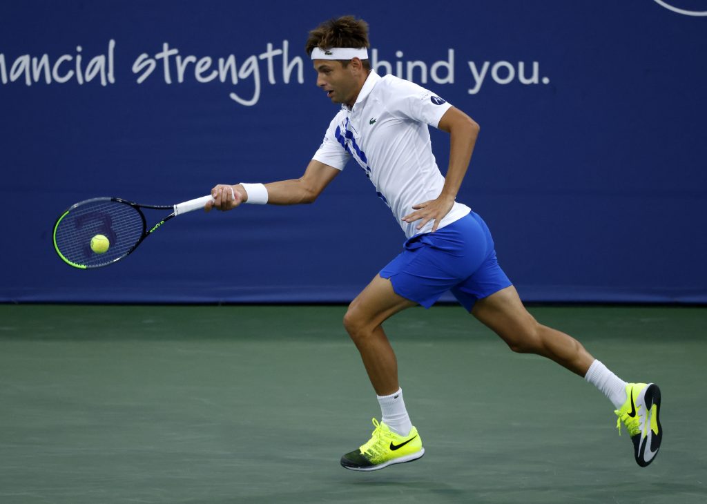 epa08627932 Filip Krajinovic of Serbia in action against Milos Raonic of Canada during a Western and Southern Open quarter-finals match at the USTA National Tennis Center in Flushing Meadows, New York, USA, 26 August 2020.  EPA-EFE/JASON SZENES