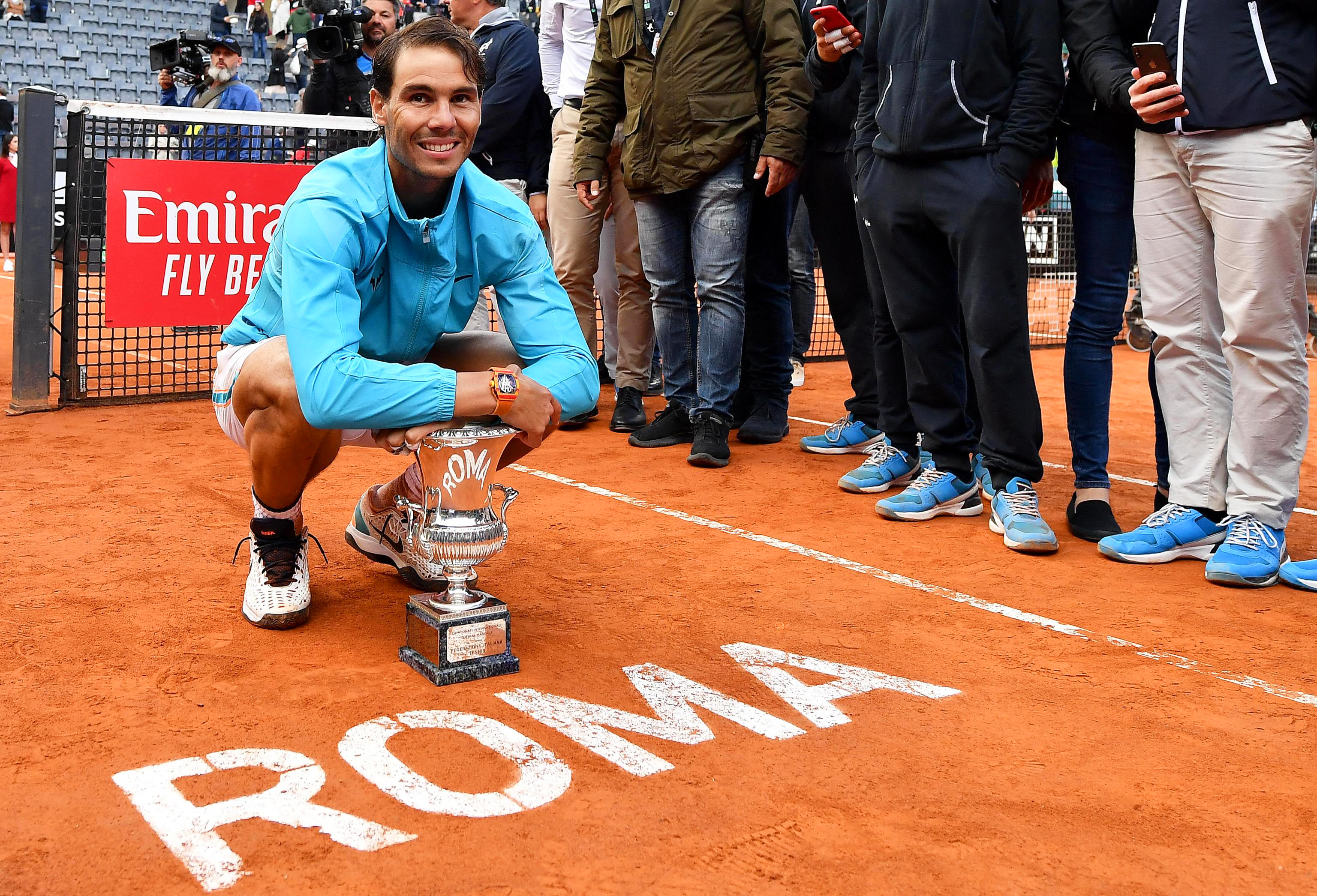 epa07585050 Rafael Nadal of Spain poses with his trophy after defeating Novak Djokovic of Serbia in their men's singles final match at the Italian Open tennis tournament in Rome, Italy, 19 May 2019.  EPA-EFE/ETTORE FERRARI