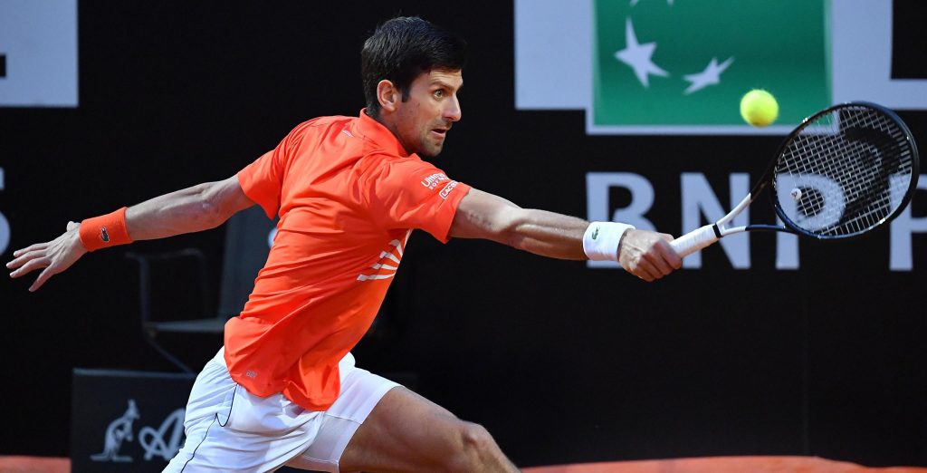 epa07582230 Novak Djokovic of Serbia in action against Diego Schwartzman of Argentina during their men's singles semi final match at the Italian Open tennis tournament in Rome, Italy, 18 May 2019.  EPA-EFE/ETTORE FERRARI