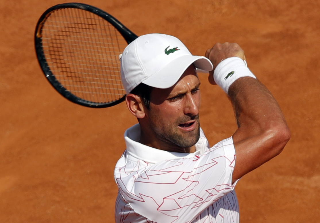 epa08672590 Novak Djokovic of Serbia in action during his second round match against Salvatore Caruso of Italy at the Italian Open in Rome, Italy, 16 September 2020.  EPA-EFE/Clive Brunskill / POOL