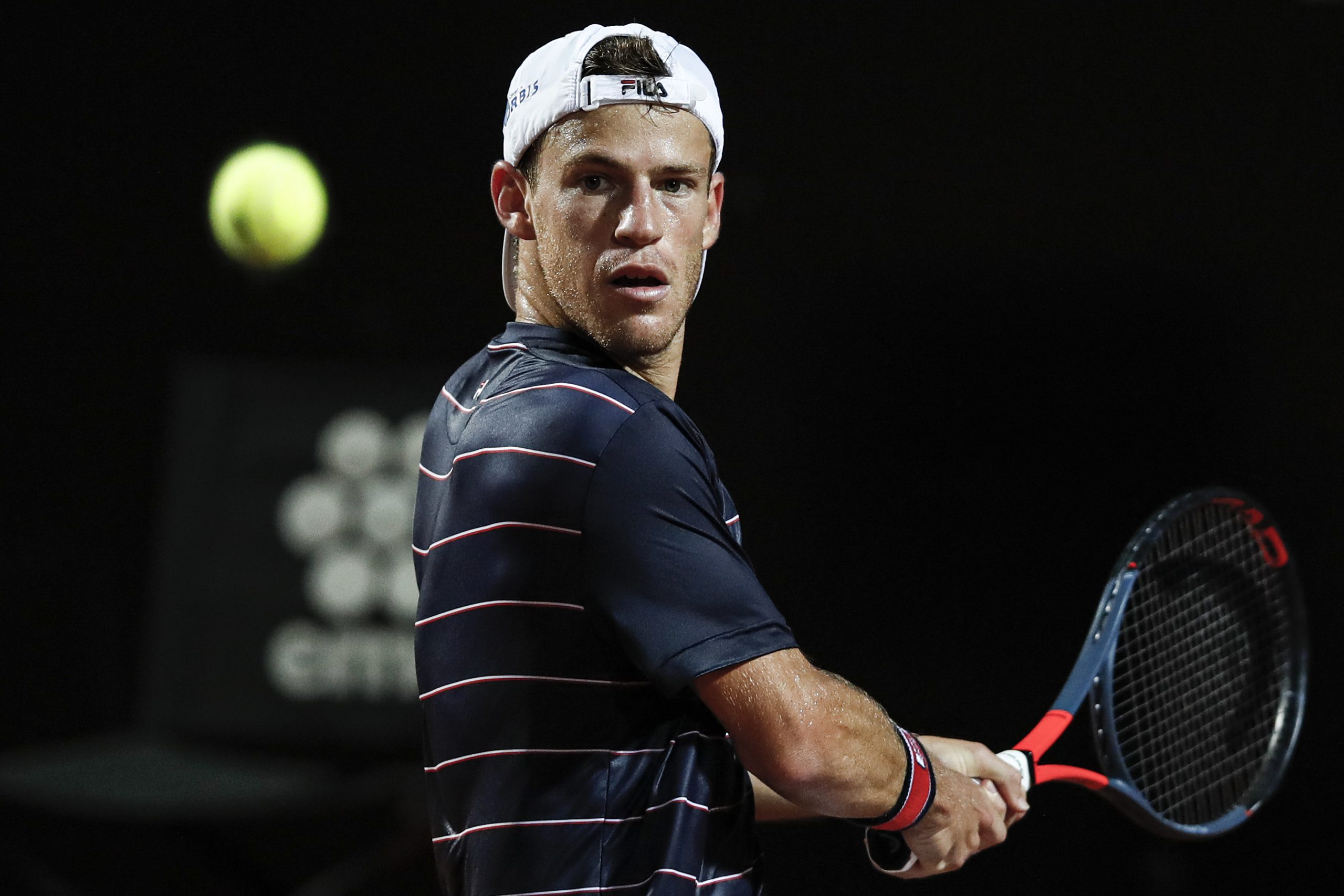 epa08682655 Diego Schwartzman of Argentina in action during his men's singles quarter-finals round match against Rafael Nadal of Spain at the Italian Open tennis tournament in Rome, Italy, 19 September 2020.  EPA-EFE/Clive Brunskill / POOL
