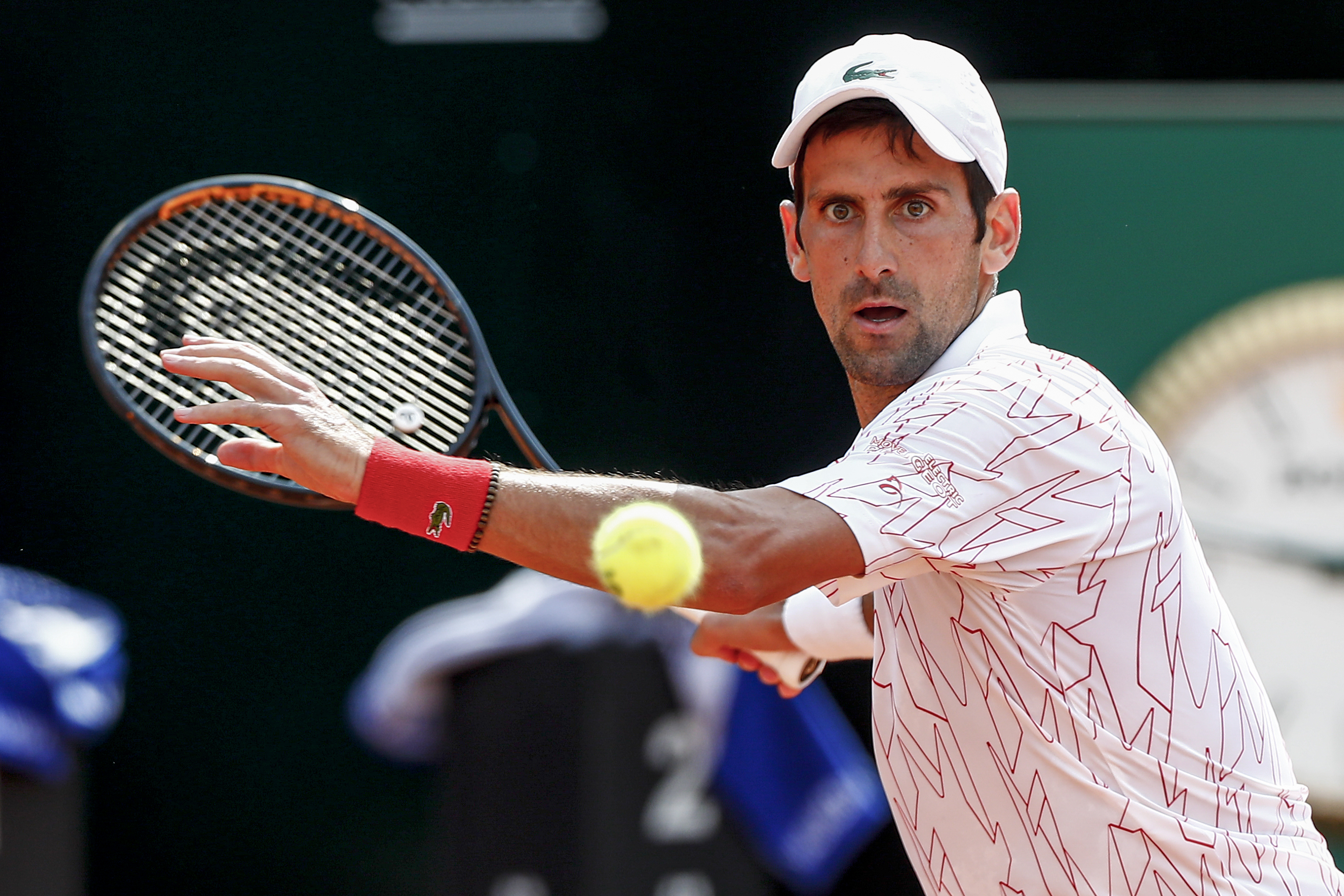 epa08681305 Novak Djokovic of Serbia in action during his men's singles quarter-finals round match against Dominik Koepfer of Germany at the Italian Open tennis tournament in Rome, Italy, 19 September 2020.  EPA-EFE/Angelo Carconi / POOL