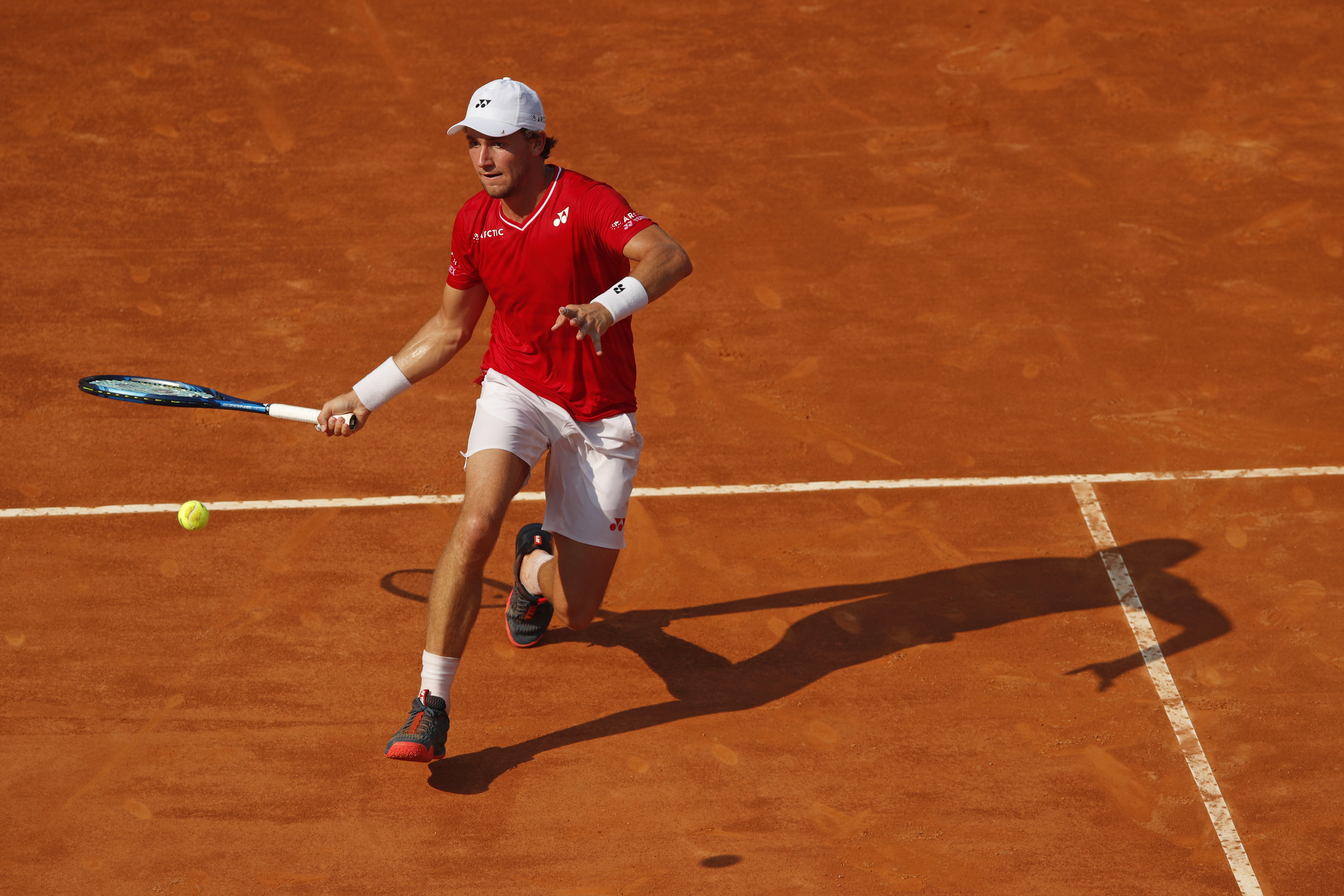 epa08683773 Casper Ruud of Norway in action during his semi final match against Novak Djokovic of Serbia at the Italian Open tennis tournament in Rome, Italy, 20 September 2020.  EPA-EFE/Clive Brunskill / POOL