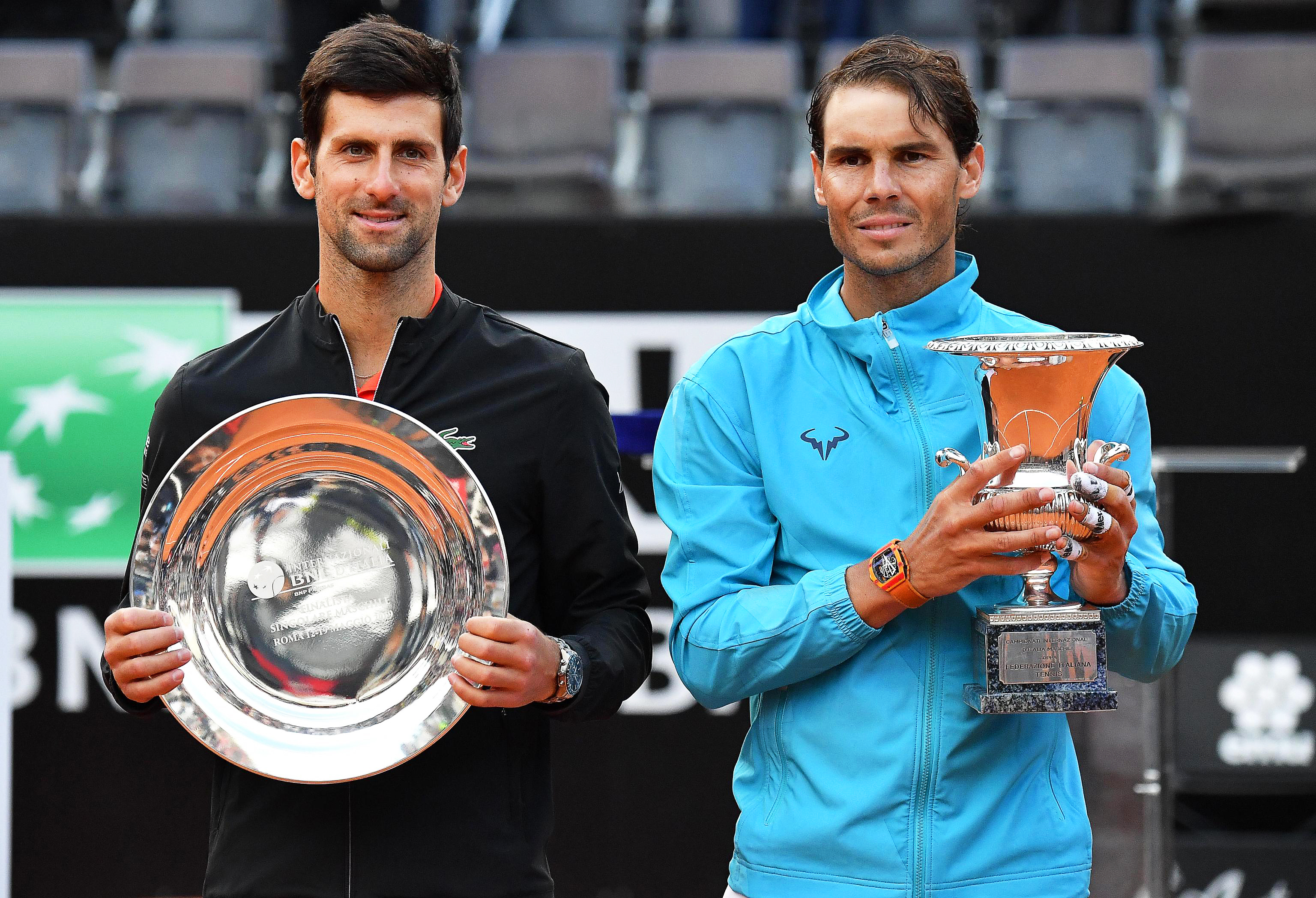 epa07584980 Rafael Nadal (R) of Spain poses with his trophy after defeating Novak Djokovic (L) of Serbia in their men's singles final match at the Italian Open tennis tournament in Rome, Italy, 19 May 2019.  EPA-EFE/ETTORE FERRARI