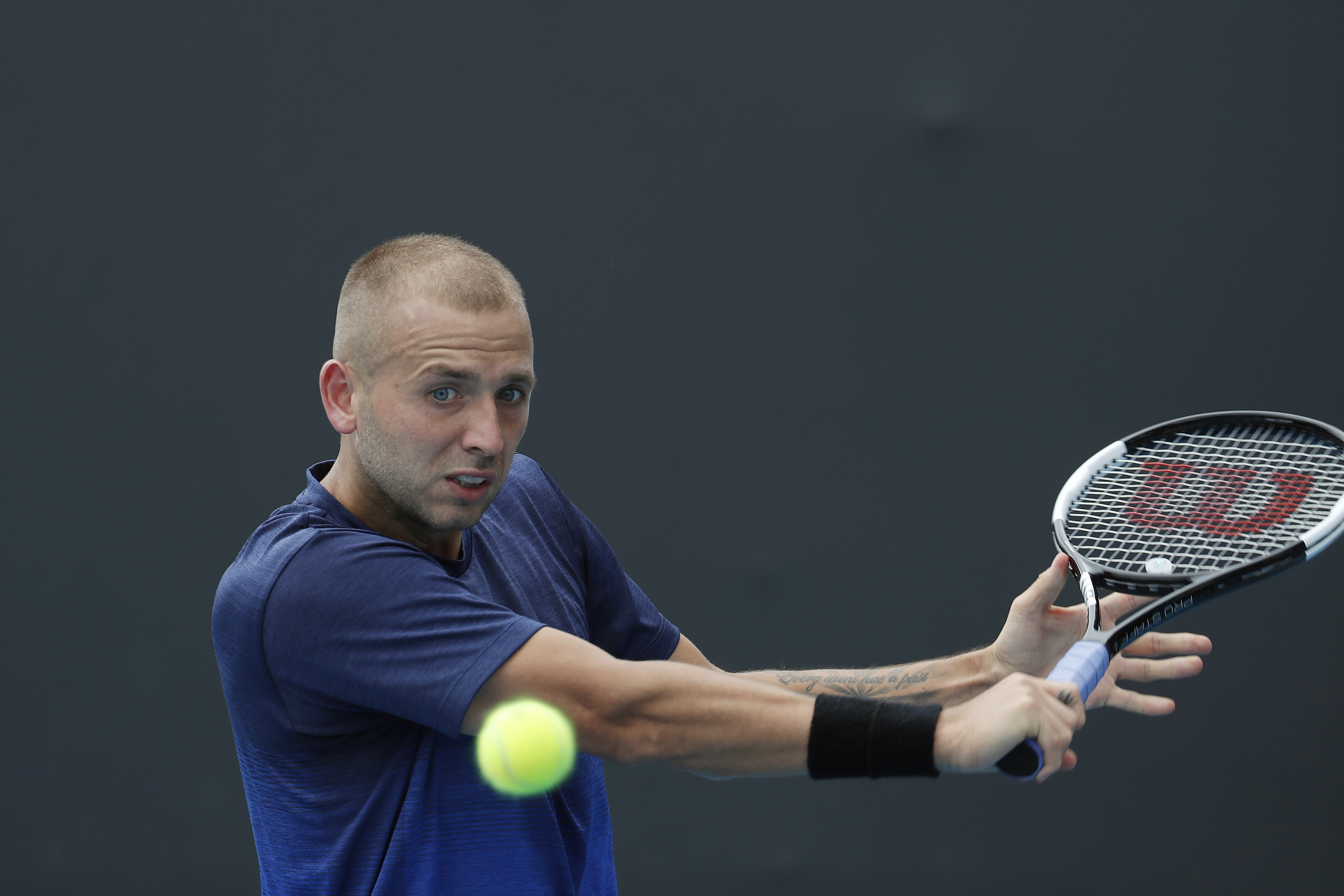 epa08149386 Dan Evans of Britain in action during his men's singles second round match against Yoshihito Nishioka of Japan at the Australian Open Grand Slam tennis tournament in Melbourne, Australia, 22 January 2020. EPA-EFE/ROMAN PILIPEY