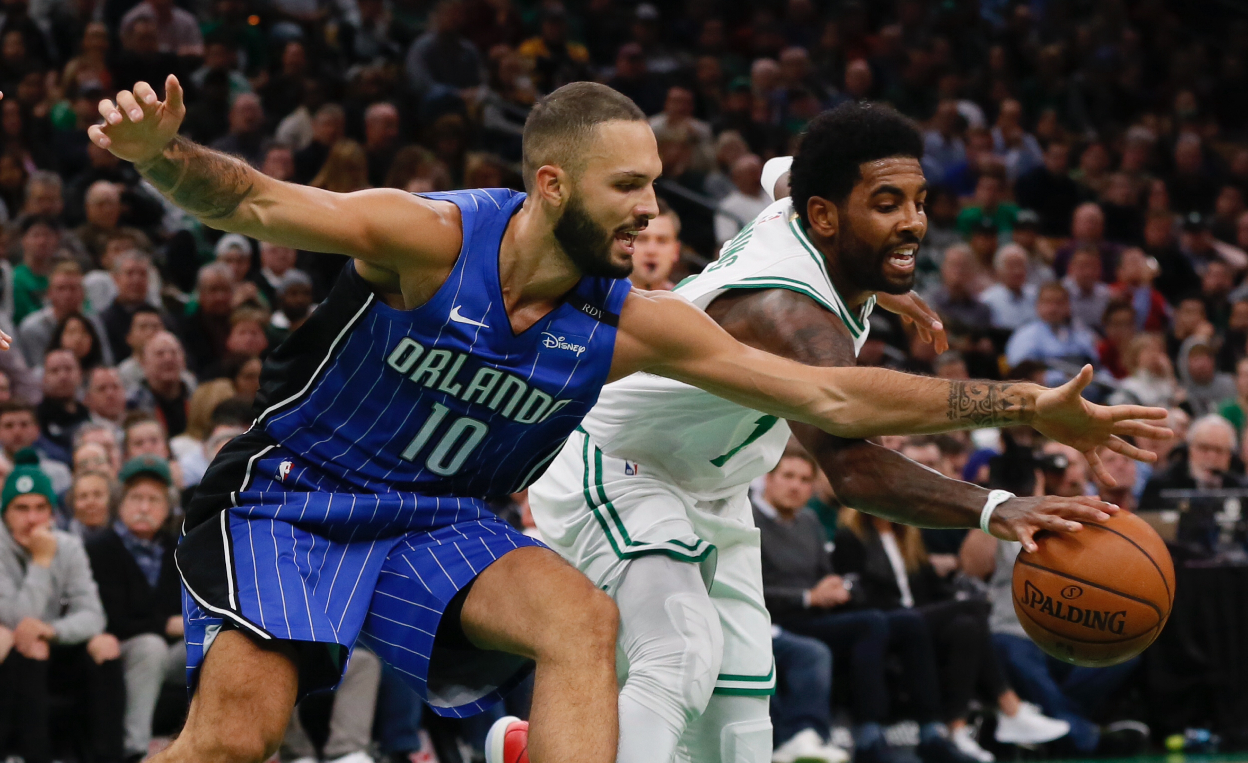 epa07112454 Boston Celtics guard Kyrie Irving (R) keeps the ball from Orlando Magic guard Evan Fournier (L) during the first half of the game at the TD Garden in Boston, Massachusetts, USA, 22 October 2018.  EPA-EFE/CJ GUNTHER  SHUTTERSTOCK OUT
