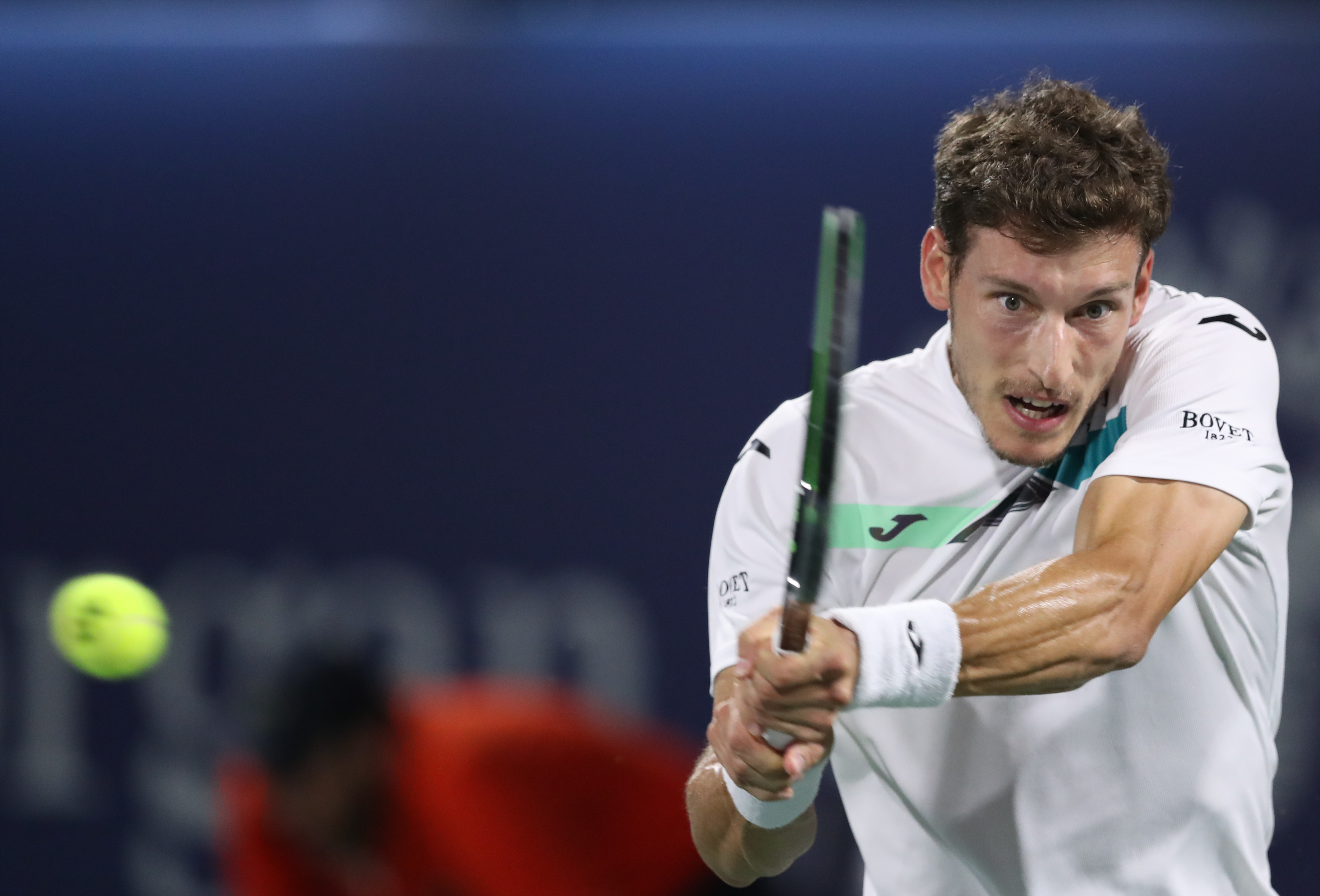 epa08247235 Pablo Carreno Busta of Spain in action during his first round match against Stefanos Tsitsipas of Greece at the Dubai Duty Free Tennis ATP Championships 2020 in Dubai, United Arab Emirates, 25 February 2020.  EPA-EFE/ALI HAIDER