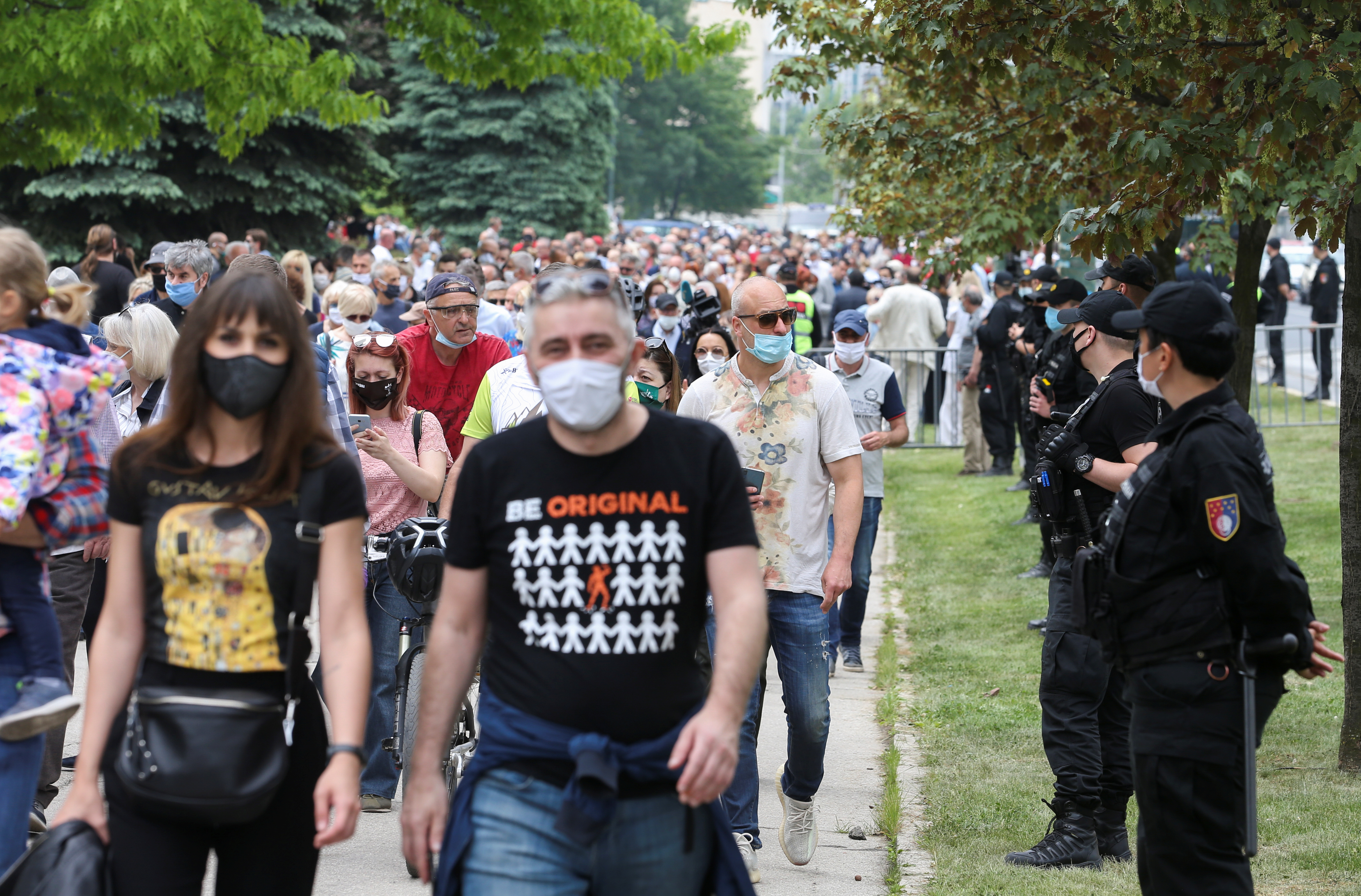 Police officers stand guard, as they secure a protest against a mass for the Nazi collaborators in Sarajevo, Bosnia and Herzegovina, May 16, 2020. REUTERS/Dado Ruvic - RC2MPG9TQ2X0
