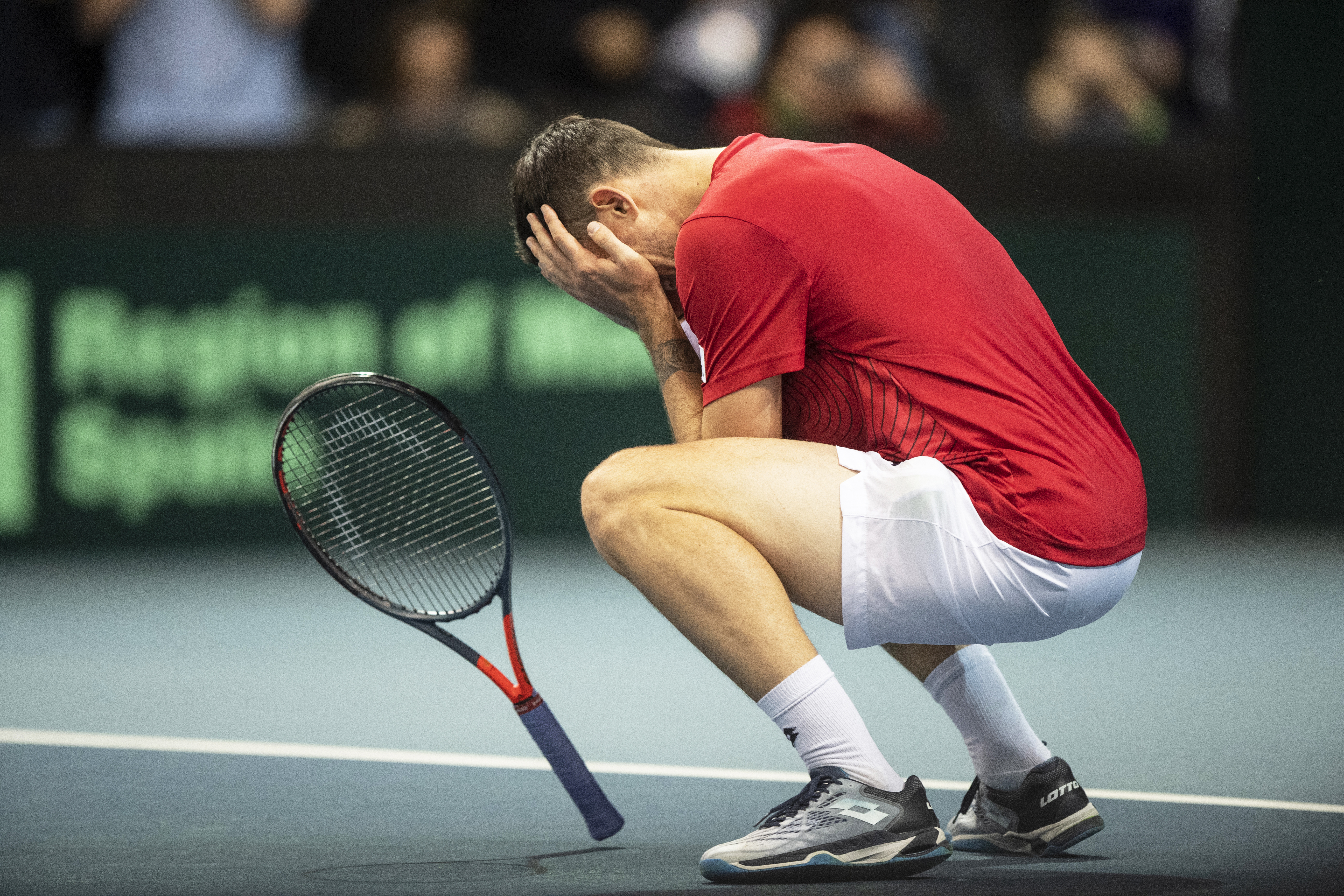 epaselect epa08276903 Dennis Novak of Austria celebrates after defeating Pablo Cuevas of Uruguay during the Davis Cup qualifier between Austria and Uruguay in Premstaetten, near Graz, Austria, 07 March 2020.  EPA-EFE/CHRISTIAN BRUNA