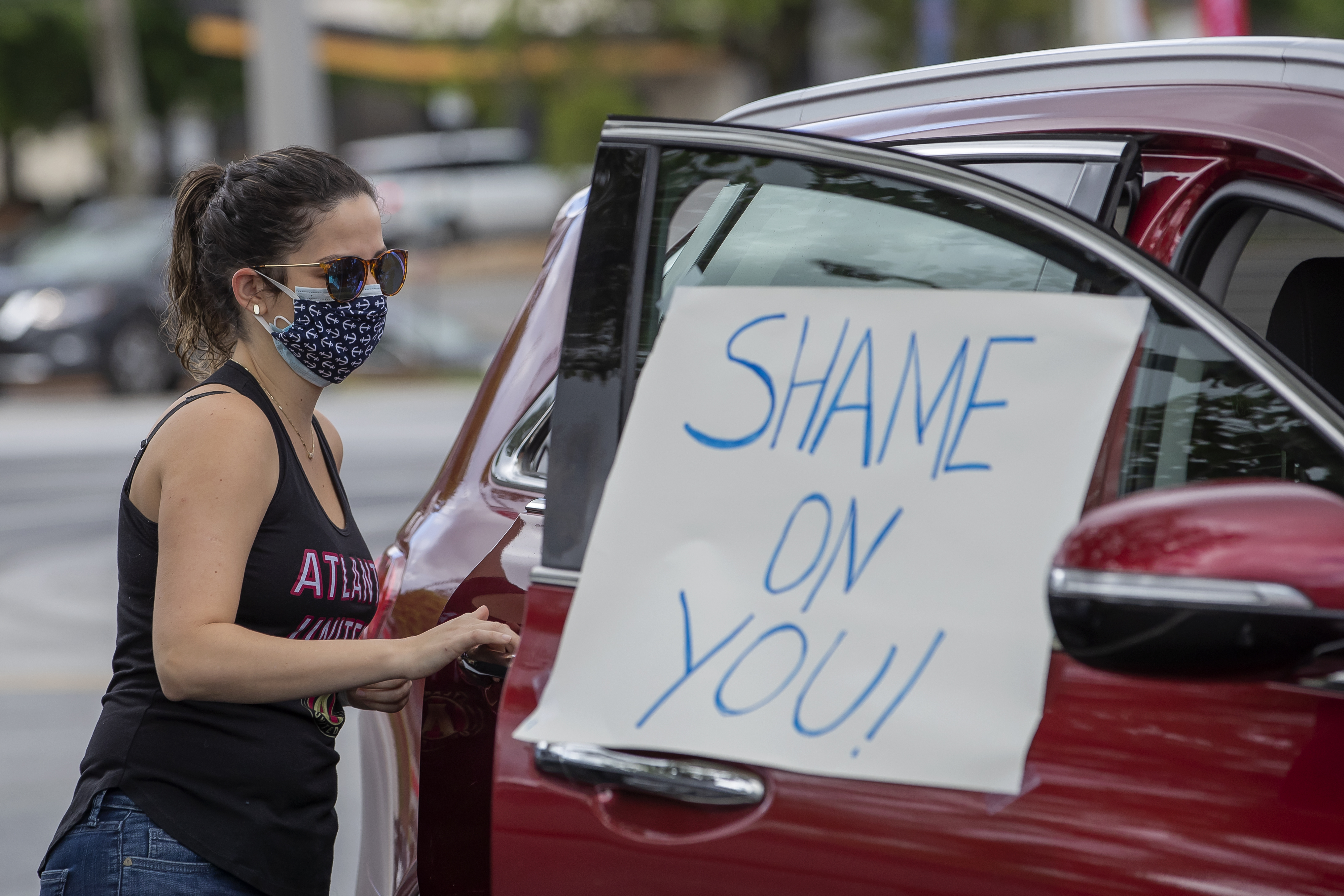 Protest against Georgia Govenor Brian Kemp allowing business reopening during coronavirus COVID-19 pandemic