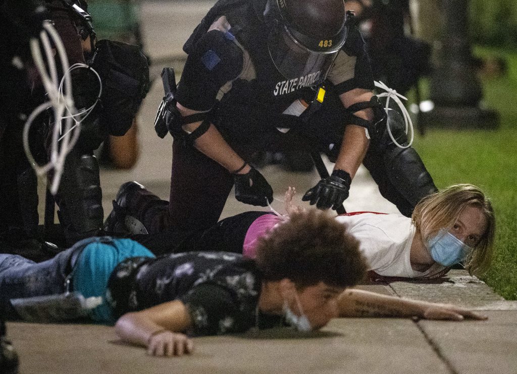 Protesters are handcuffed outside the State Capitol in St. Paul, Minn., Monday night, June 1, 2020, during protests over the death of George Floyd, who died May 25 after being restrained by Minneapolis police. (Carlos Gonzalez/Star Tribune via AP)