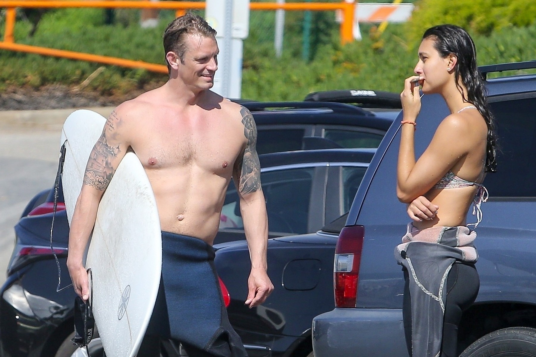 *EXCLUSIVE* Joel Kinnaman displays his inked body after hitting the waves in South Bay!