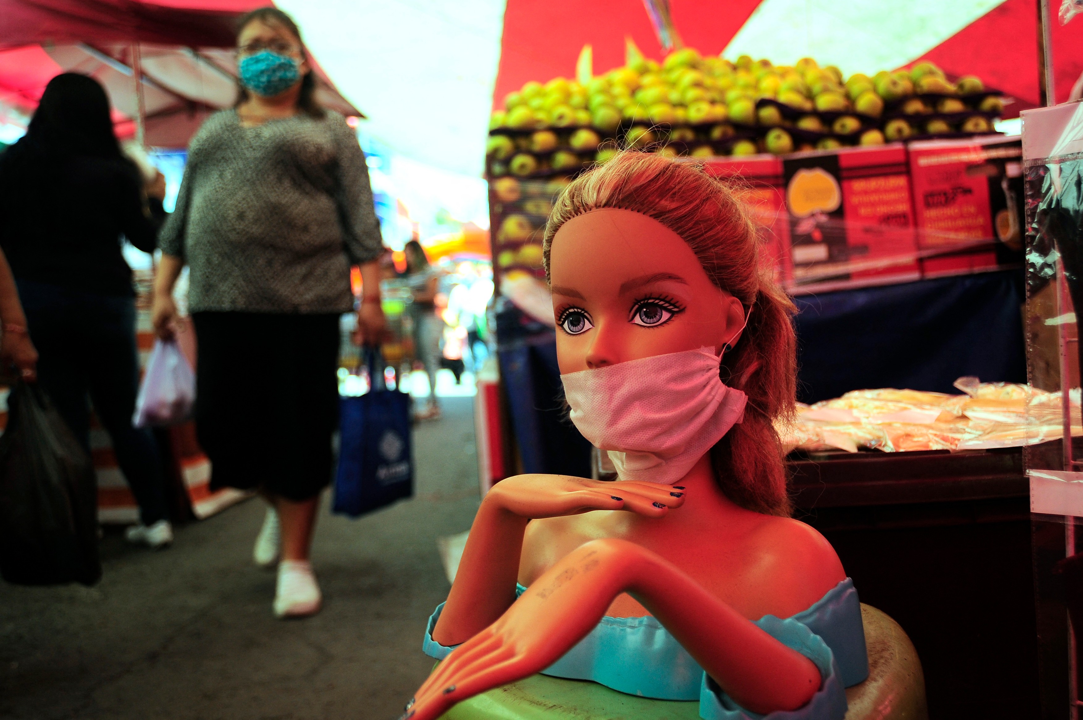 MEXICO CITY, MEXICO - MAY 5: A Barbie wears protective mask while a shopper select products at market amid of coronavirus pandemic. on May 5, 2020 in Mexico City, Mexico,Image: 517483879, License: Rights-managed, Restrictions: , Model Release: no
