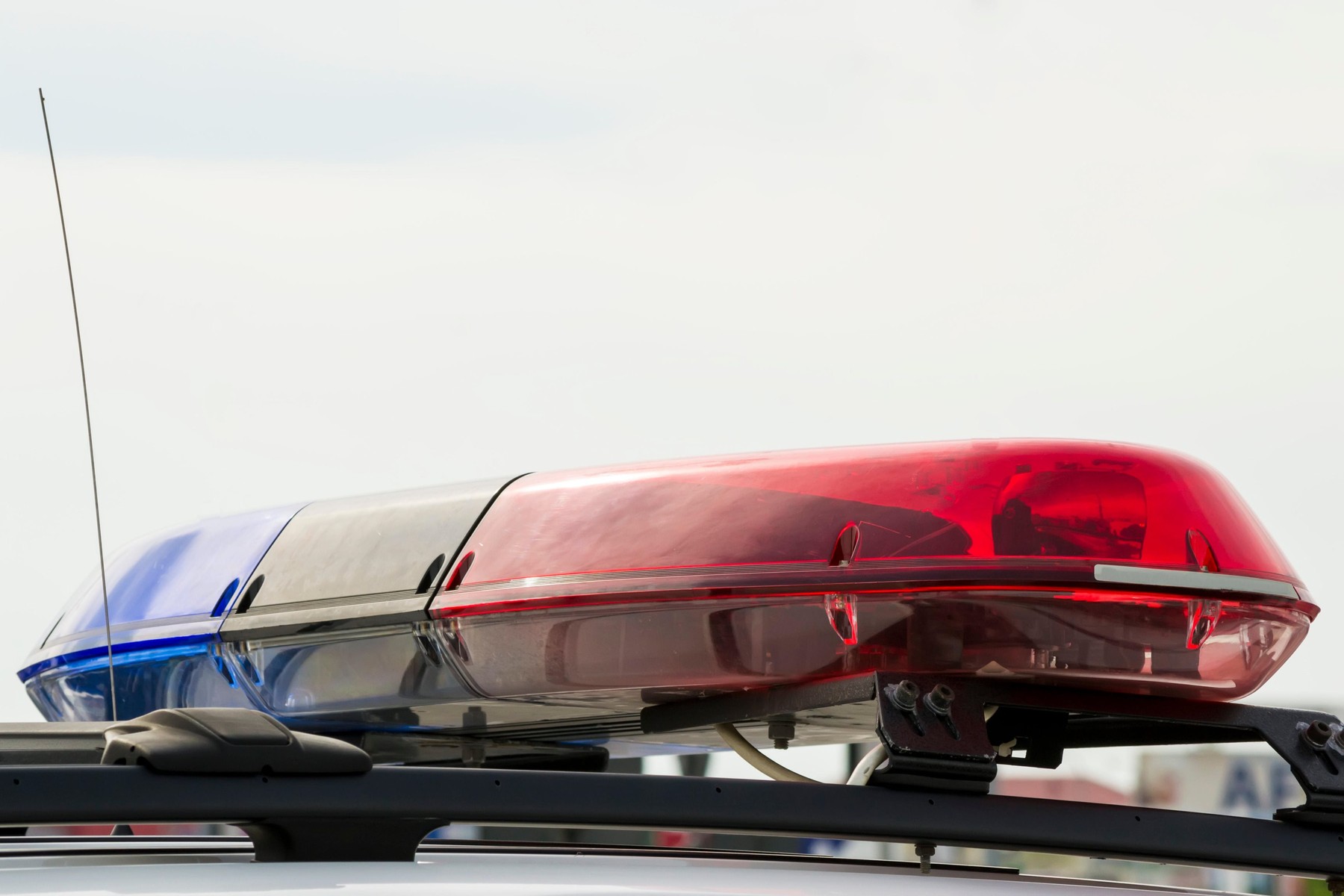 Roof mounted police light bar with typical warning red and blue lights