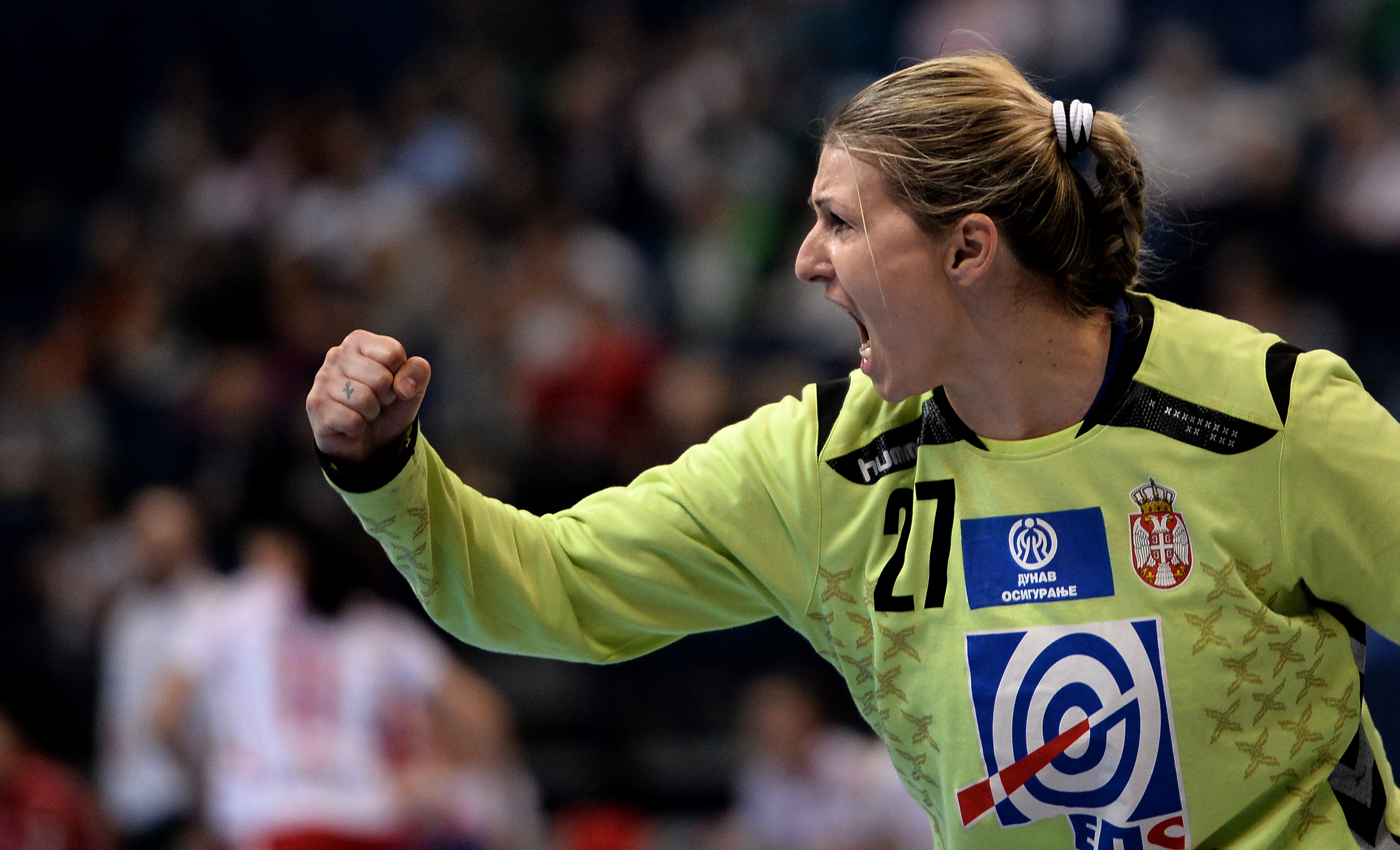epa03997348 Serbian goalkeeper Katarina Tomasevic celebrates during the semi final match between Poland and Serbia of the Women Handball World Championship in Novi Sad, Serbia, 20  December 2013.  EPA/GEORGI LICOVSKI