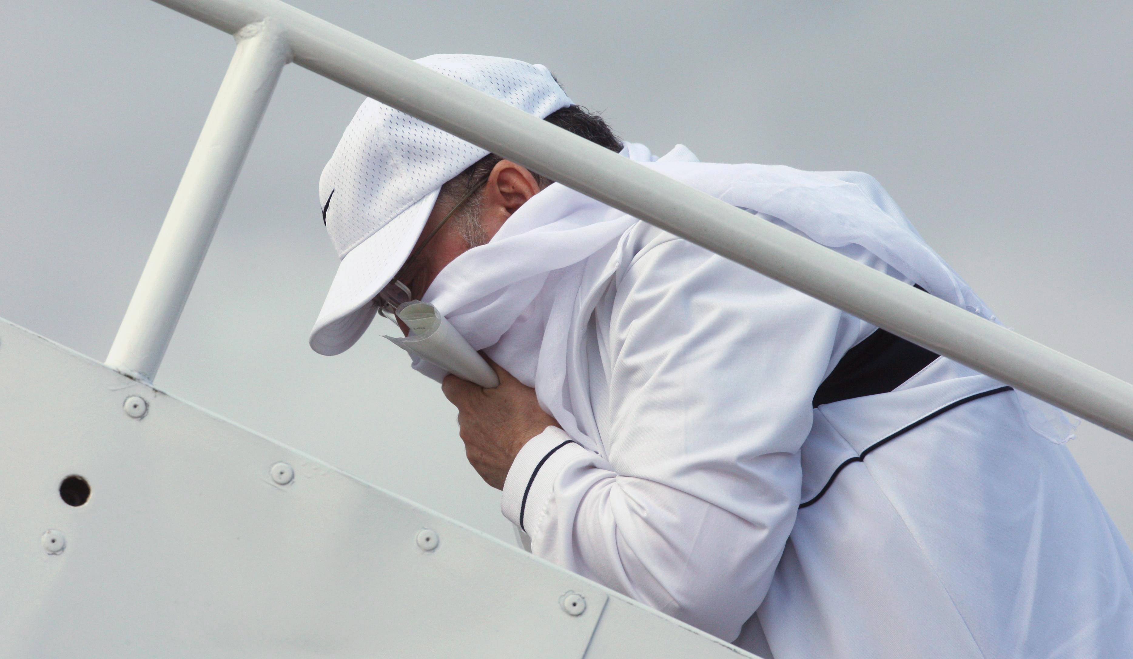 Libyan Lockerbie bomber Abdel Basset Ali al-Megrahi boards his plane