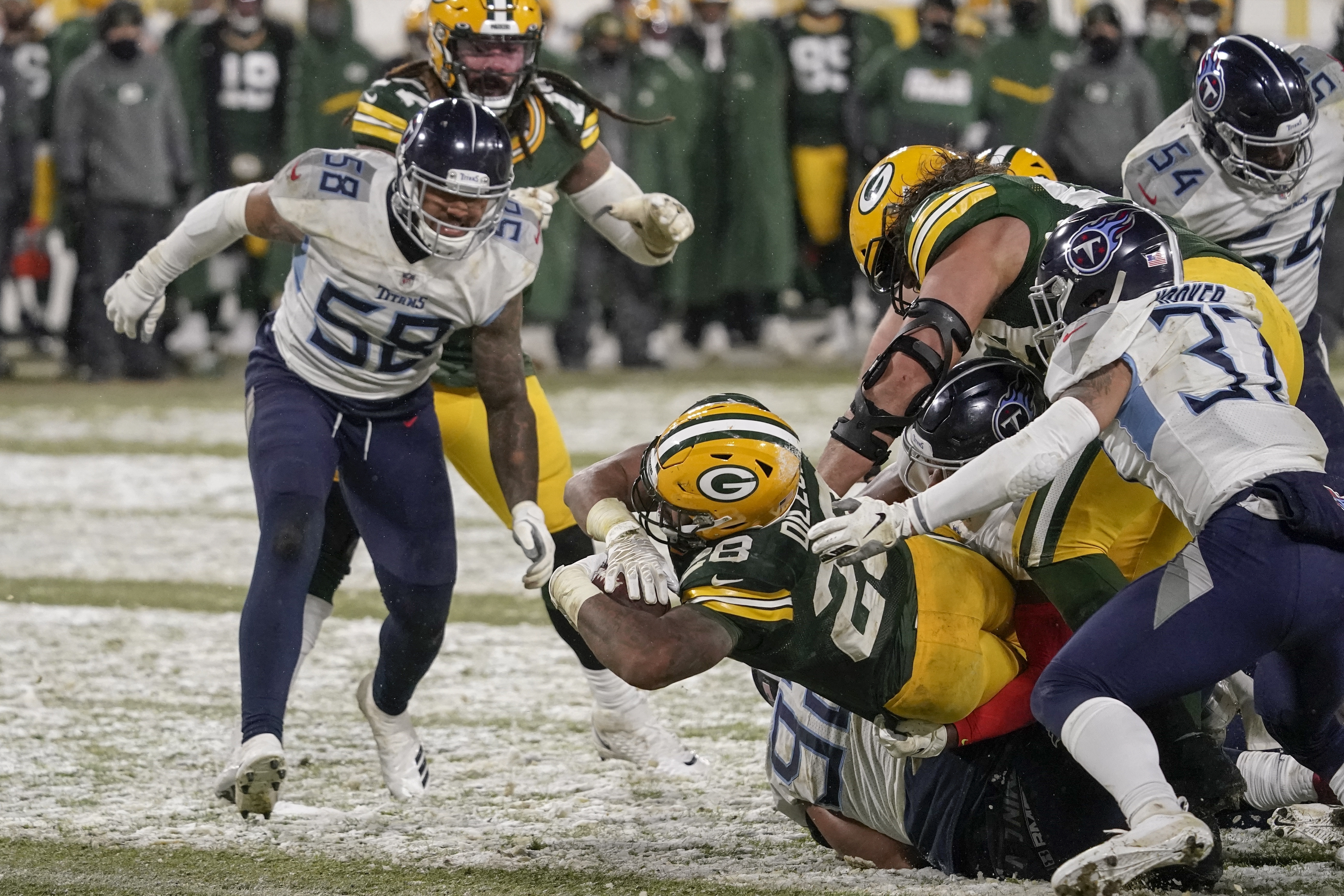 Green Bay Packers' A.J. Dillon runs for a touchdown during the second half of an NFL football game against the Tennessee Titans Sunday, Dec. 27, 2020, in Green Bay, Wis. The Packers won 40-14. (AP Photo/Morry Gash)