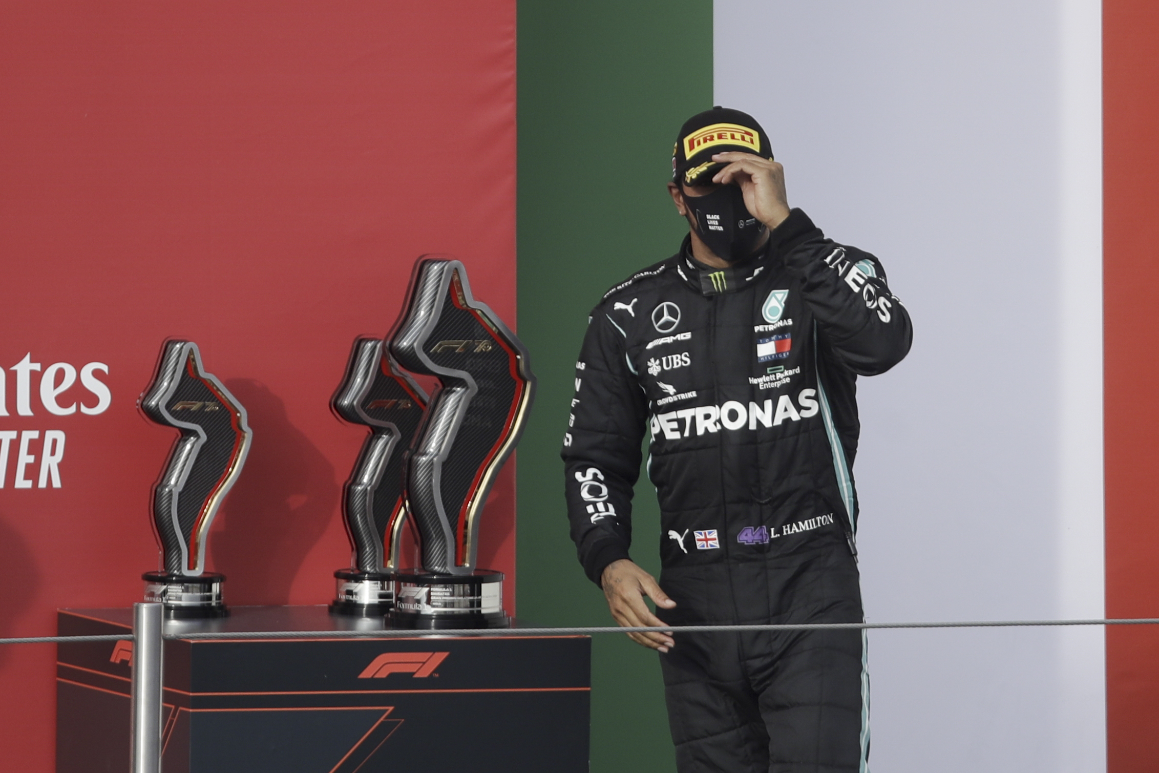 epa08790893 British Formula One driver Lewis Hamilton of Mercedes-AMG Petronas reacts on the podium after winning the Formula One Grand Prix Emilia Romagna at Imola race track, Italy, 01 November 2020.  EPA-EFE/Luca Bruno / Pool