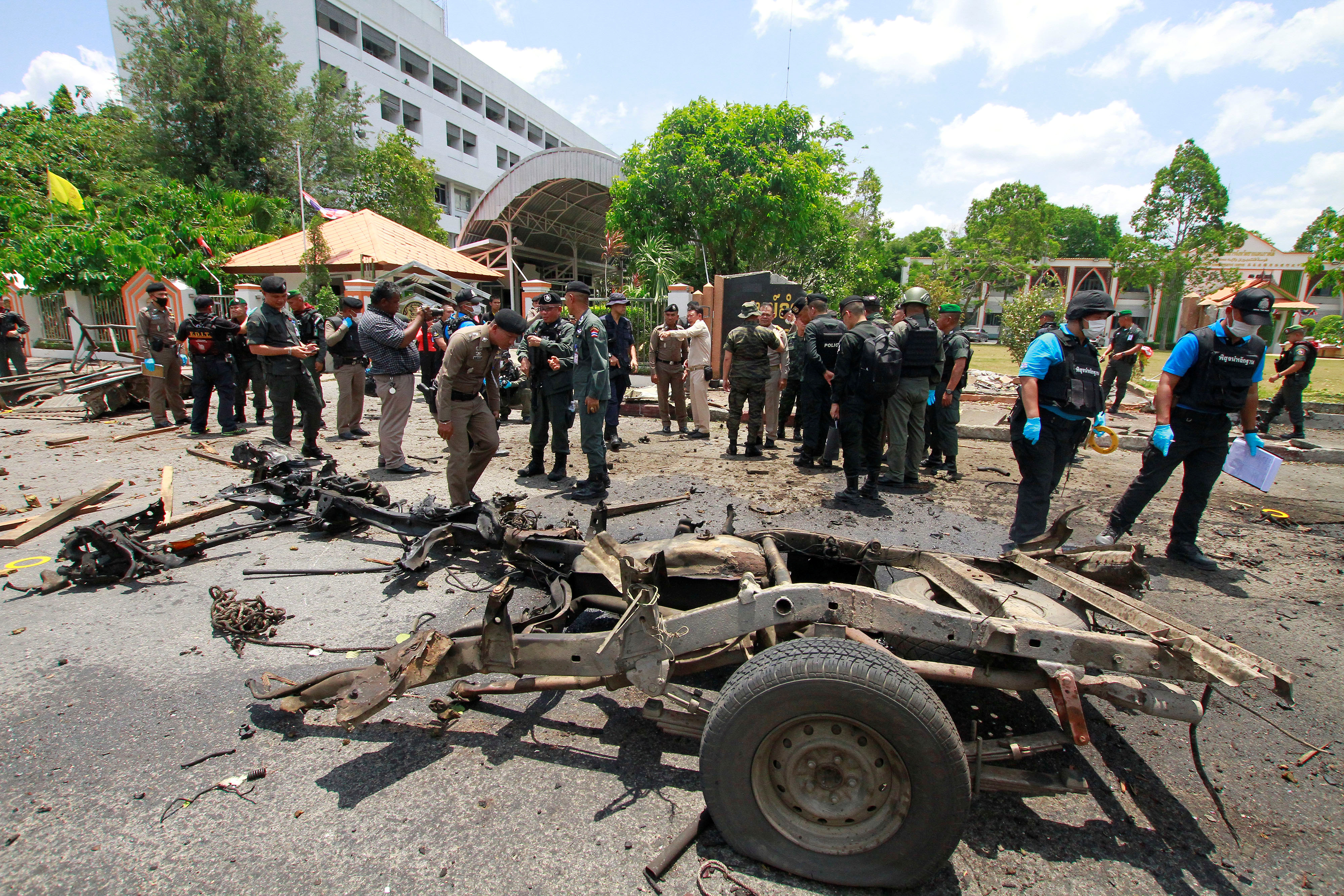 Security personnel inspect the site of a car bomb after if exploded in front of the government's Southern Border Provinces Administrative Centre in Yala, Thailand March 17, 2020. REUTERS/Surapan Boonthanom - RC2JLF9UL9EB