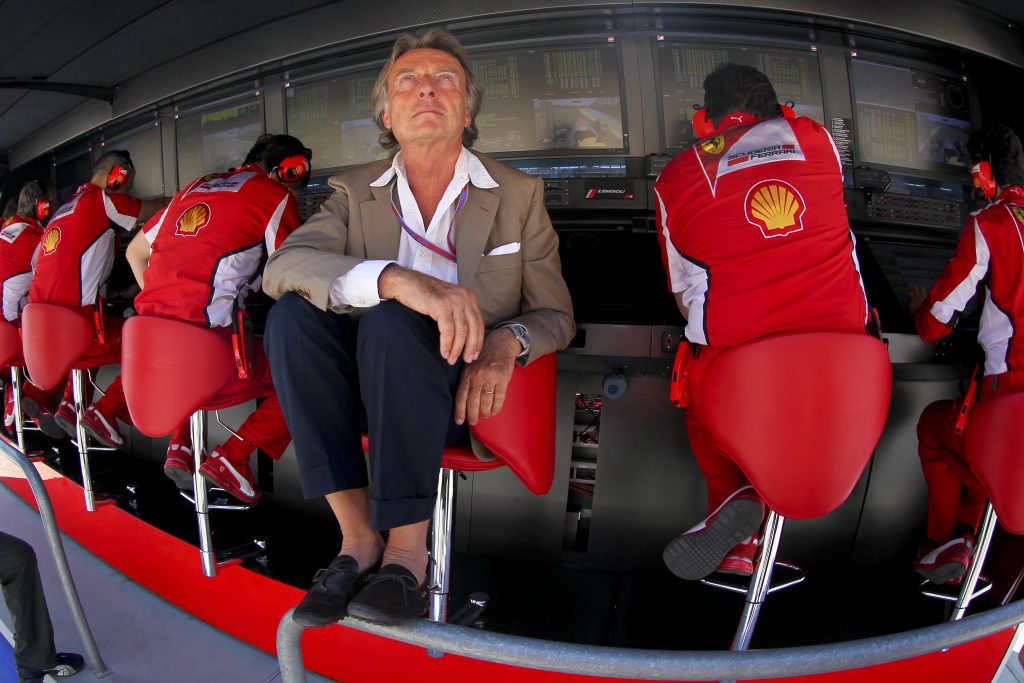 epa03278339 Ferrari Chairman Luca Cordero di Montezemolo (C) follows the qualifying session at the Valencia street circuit, in Valencia, Spain, 23 June 2012. The 2012 Formula One Grand Prix of Europe will take place on 24 June.  EPA/VALDRIN XHEMAJ